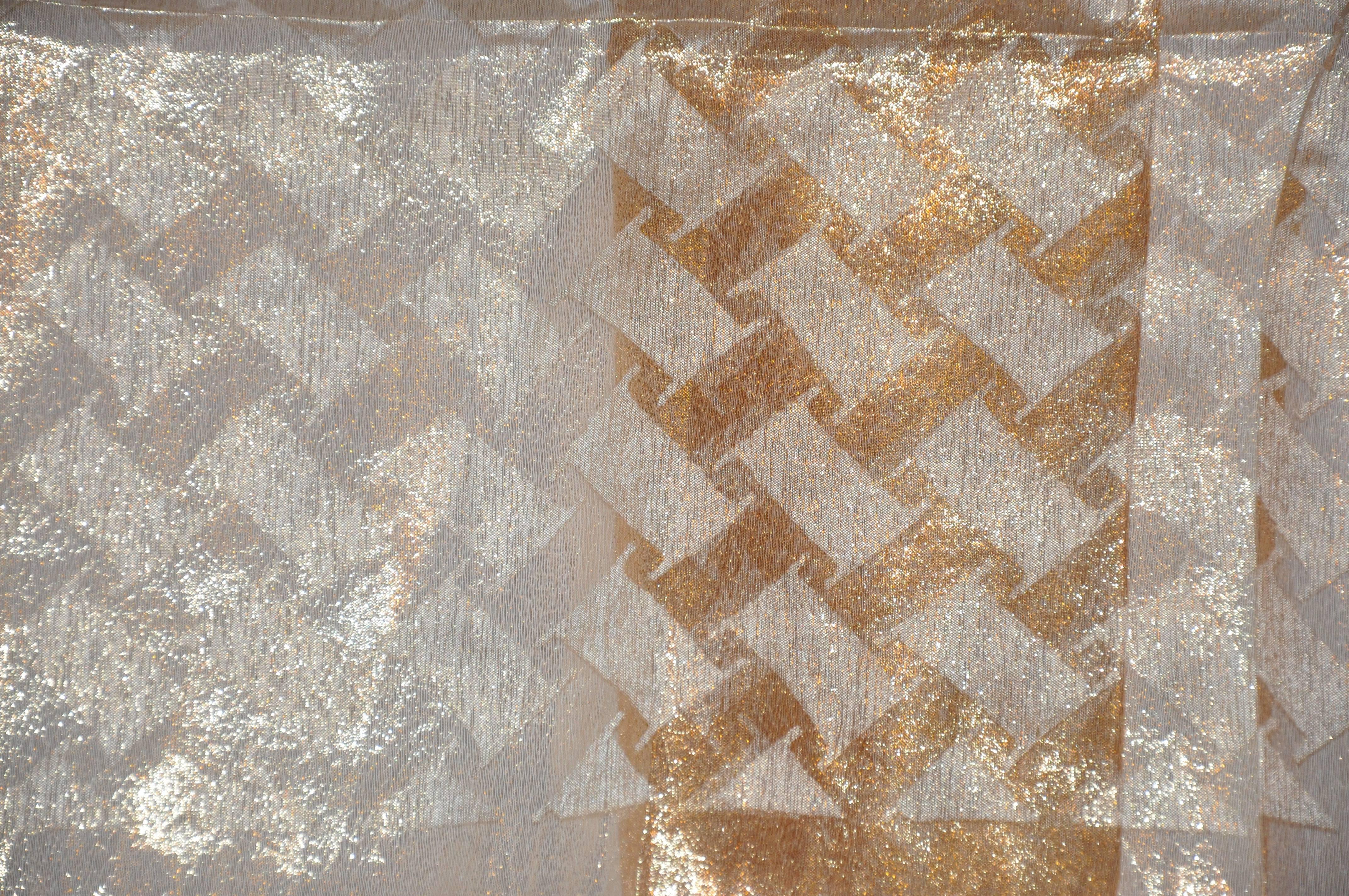 Rare gold & white metallic lame accented with a gold lame border rectangle scarf measures 17" x 46". Made in Japan.