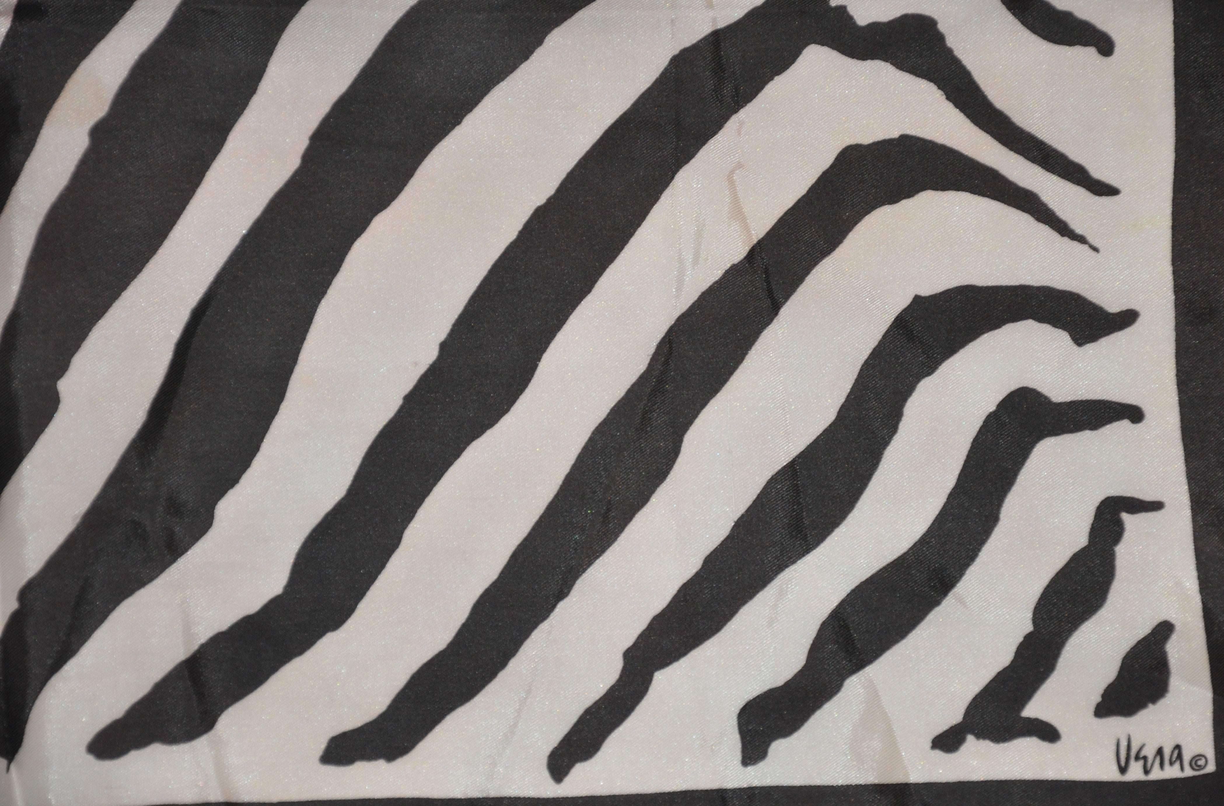 Vera fawn and black zebra stripe silk scarf measures 24" x 24" and finished with rolled edges. Made in Japan.