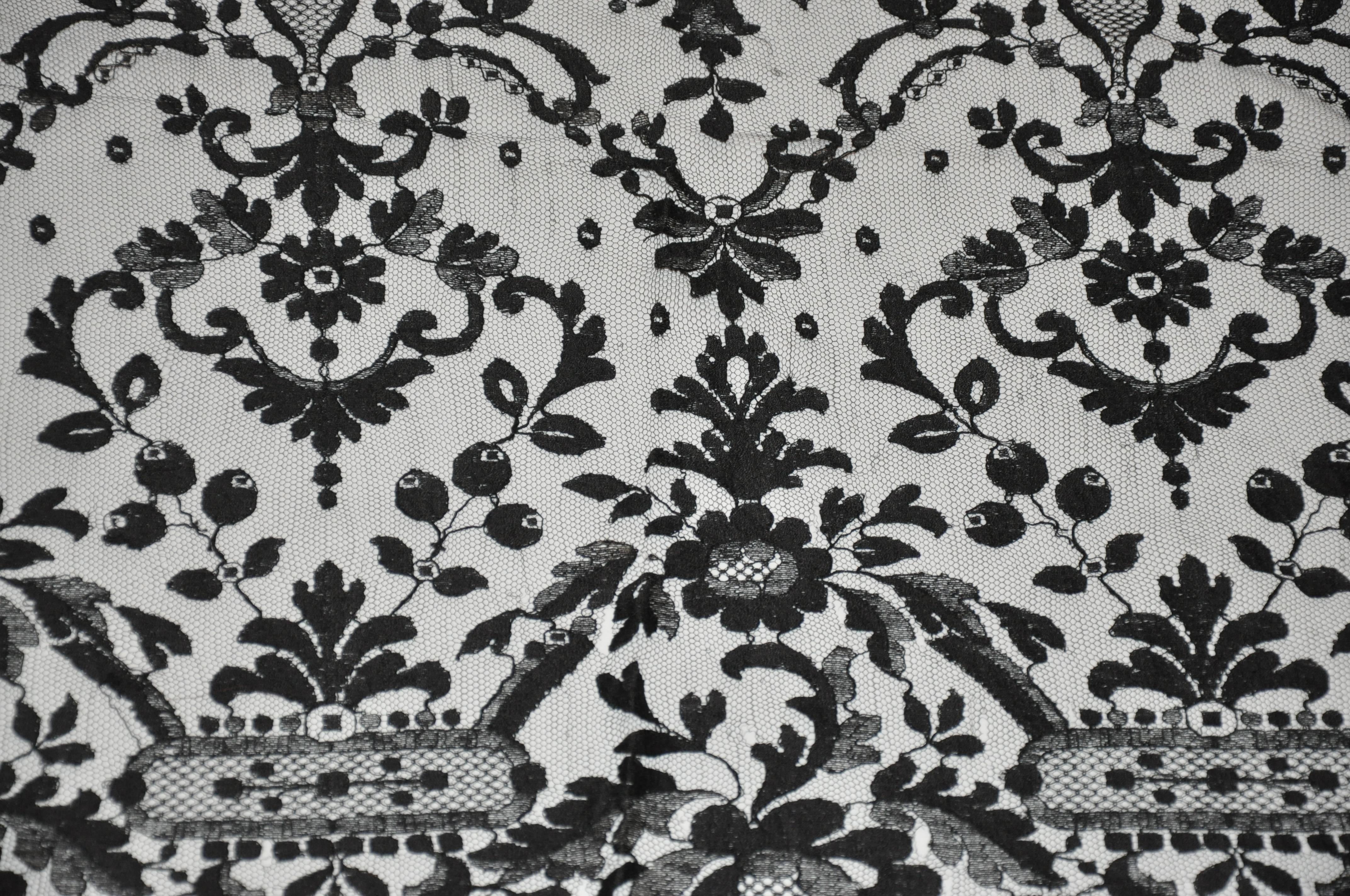 Rare huge black floral lace with netting accent "Widow Shawl" measures 30" x 77". Condition if fair, from France.