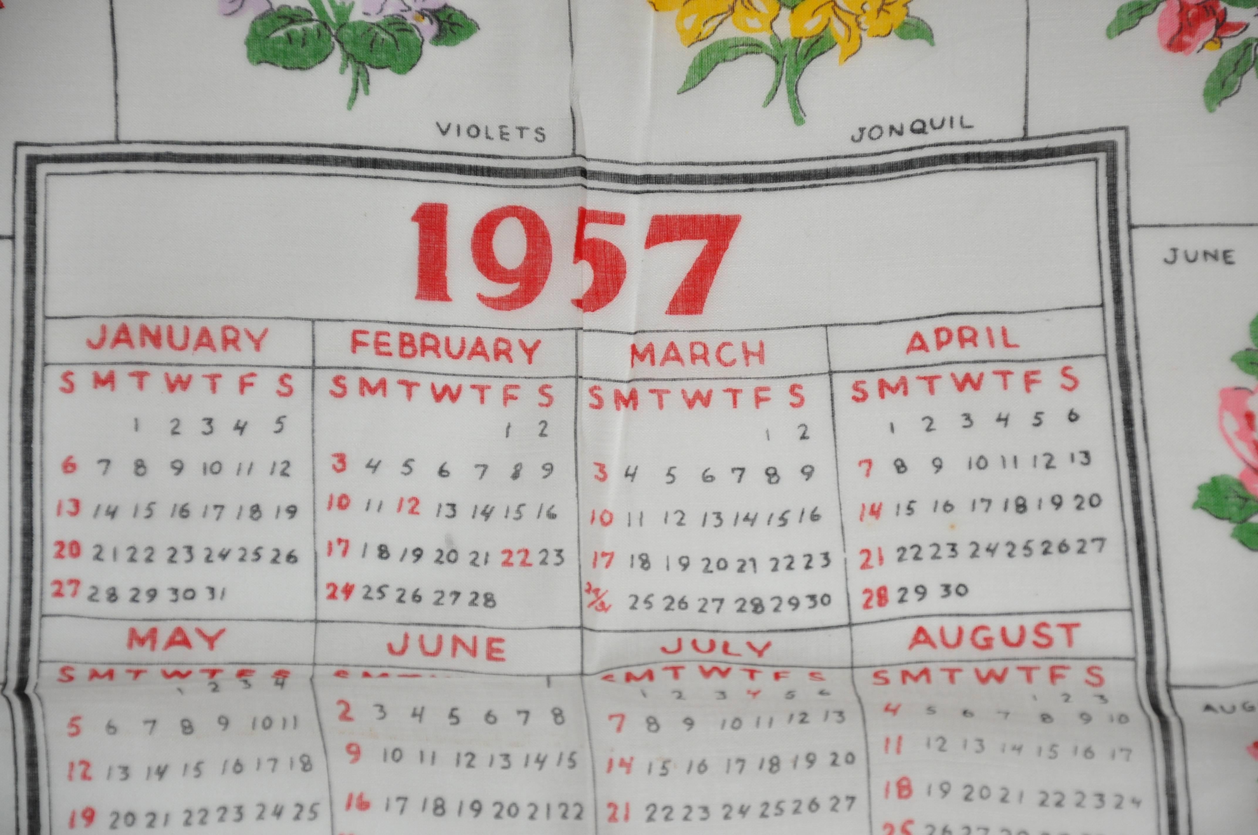 "1957" calendar cotton handkerchief measures 13 1/2" x 13 1/2" and finished with scallop edges. Made in USA.