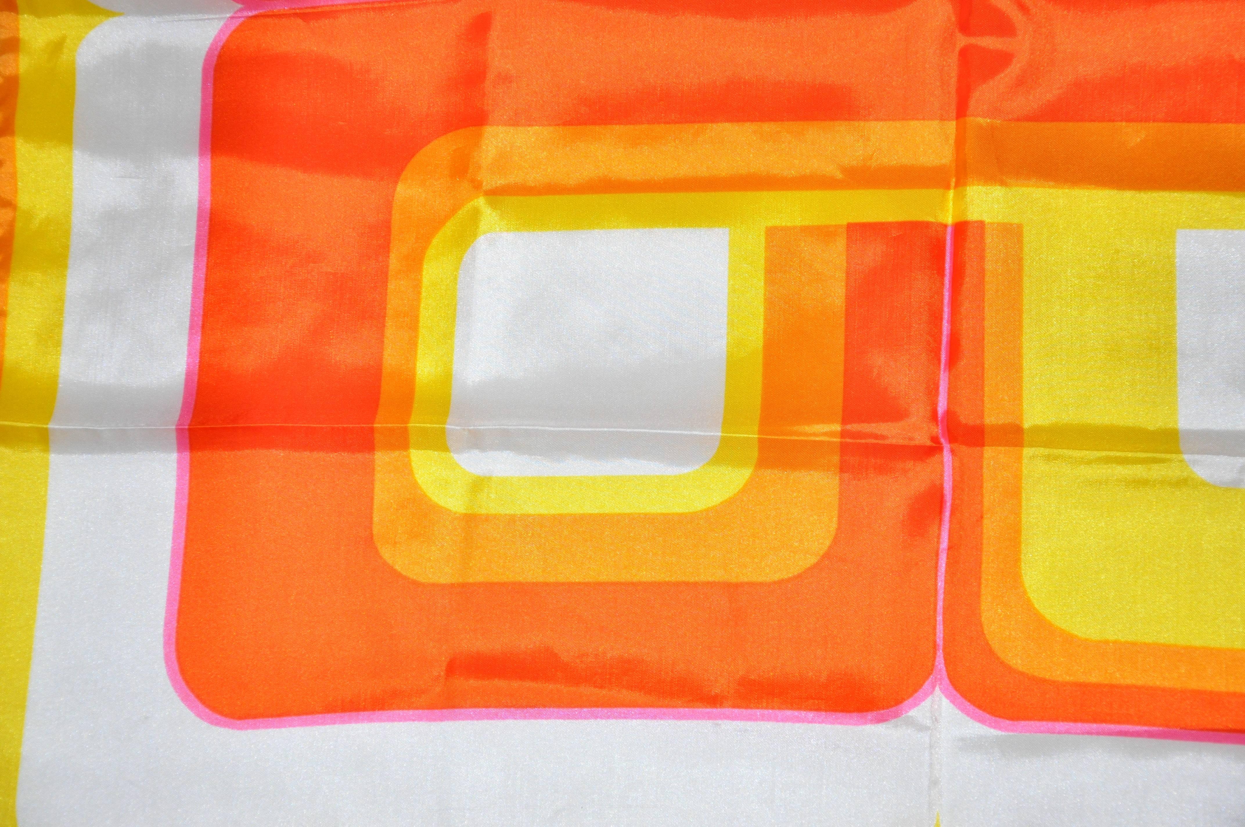 "Shades of the Sun" multi-screen scarf measures 27" x 27", Made of acetate, made in Italy.