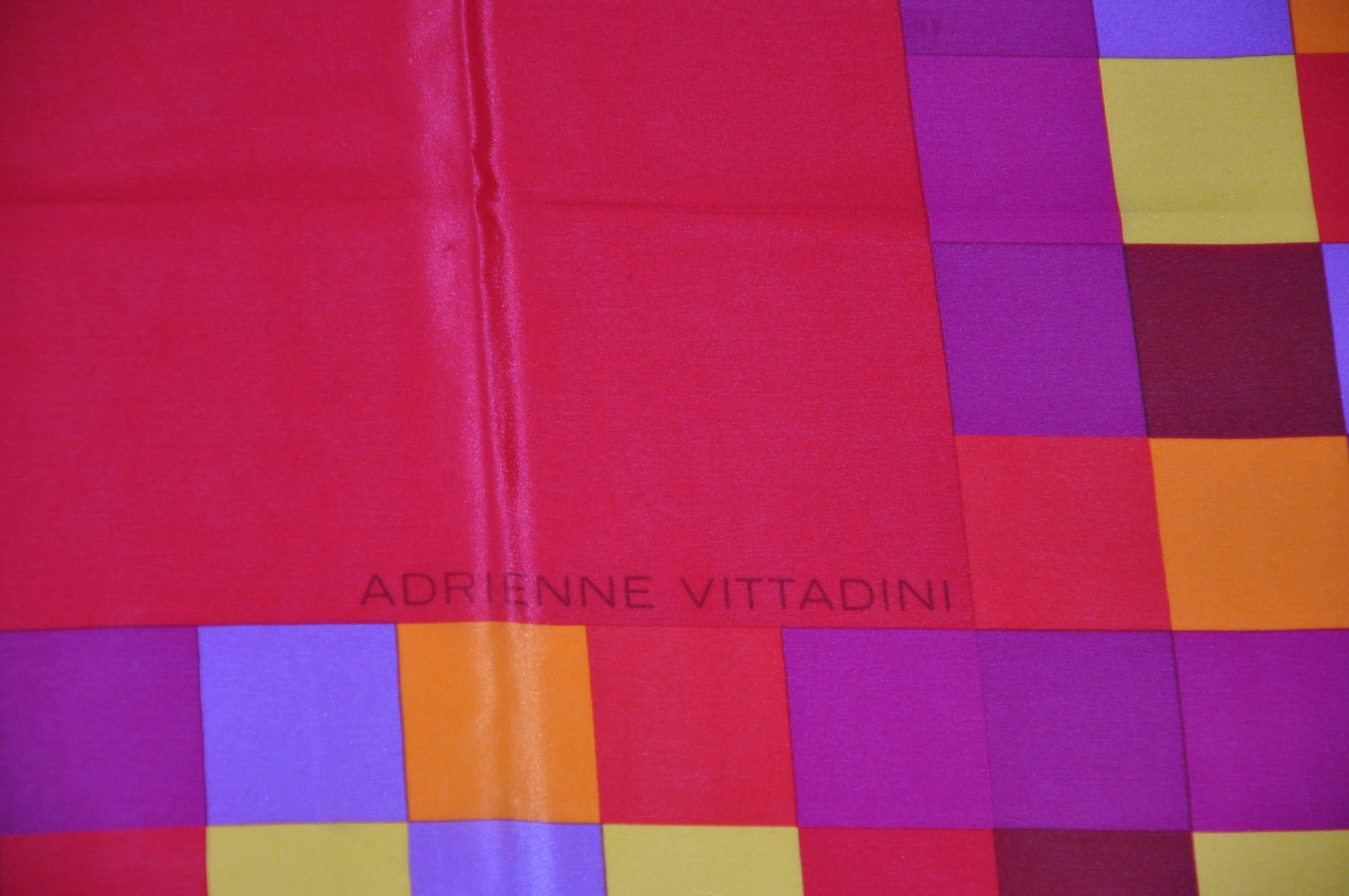 Adrienne Vittadini wonderfully bold and bright red block with mini blocks silk scarf measures 34" x 35", finished with rolled edges, Made in Italy.