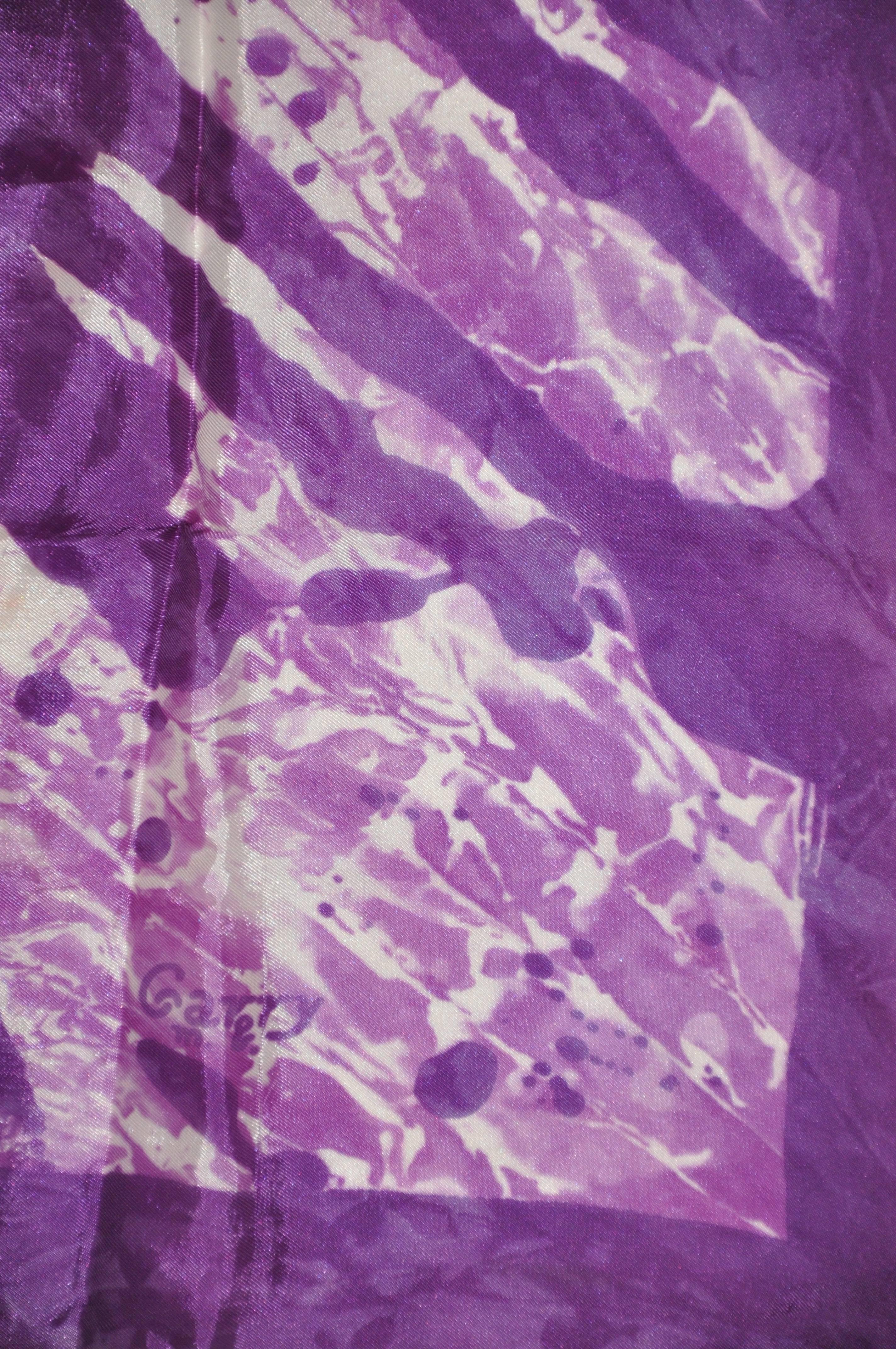 Purple, violet & white "tie dye" style scarf measures 26" x 27", finished with hand-rolled edges. Made of acetate, and made in Italy.