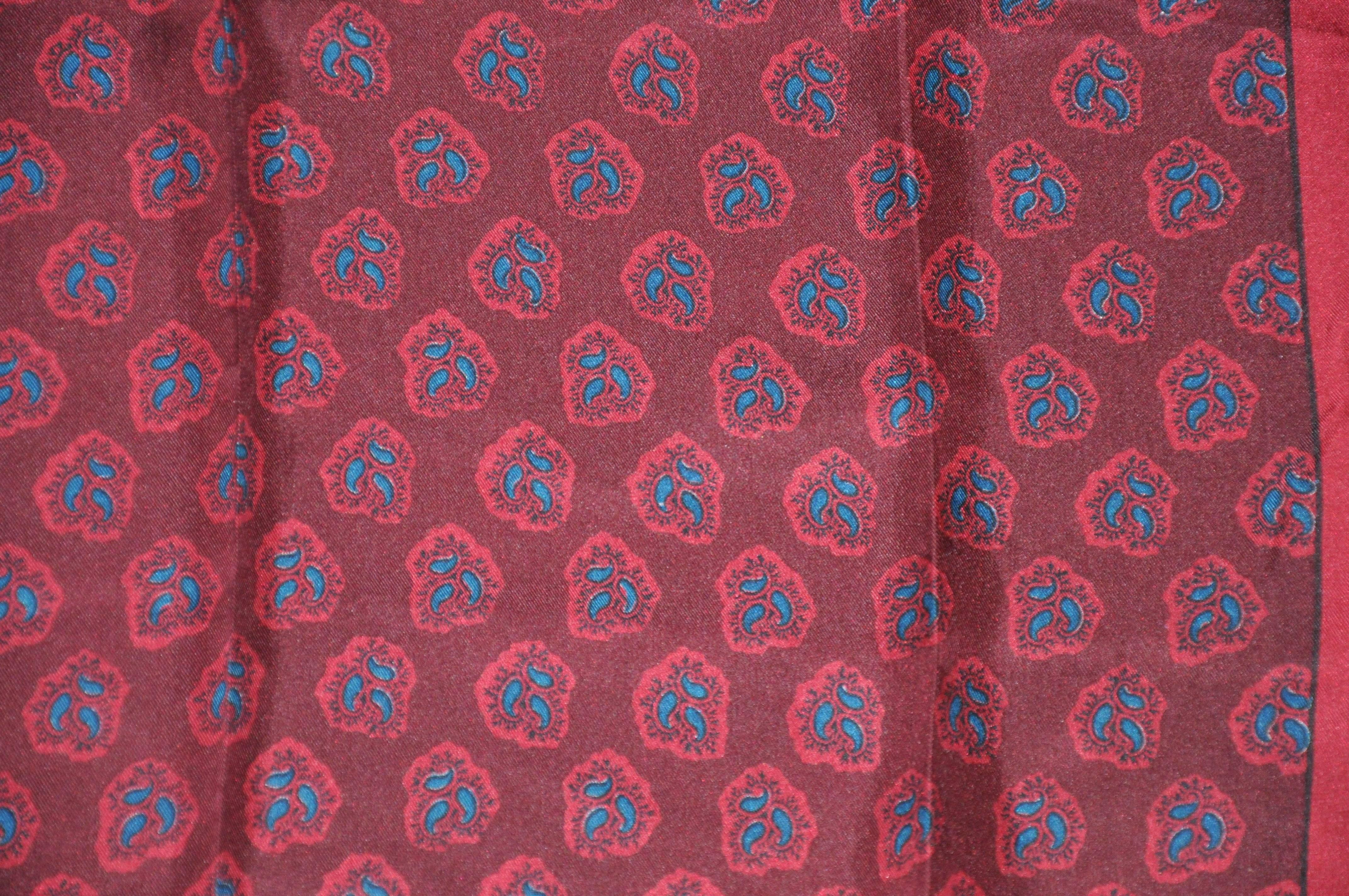 Liberty of London "Shades of burgundy" palsey silk scarf measures 23" x 24", finished with hand-rolled edges. Made in England.