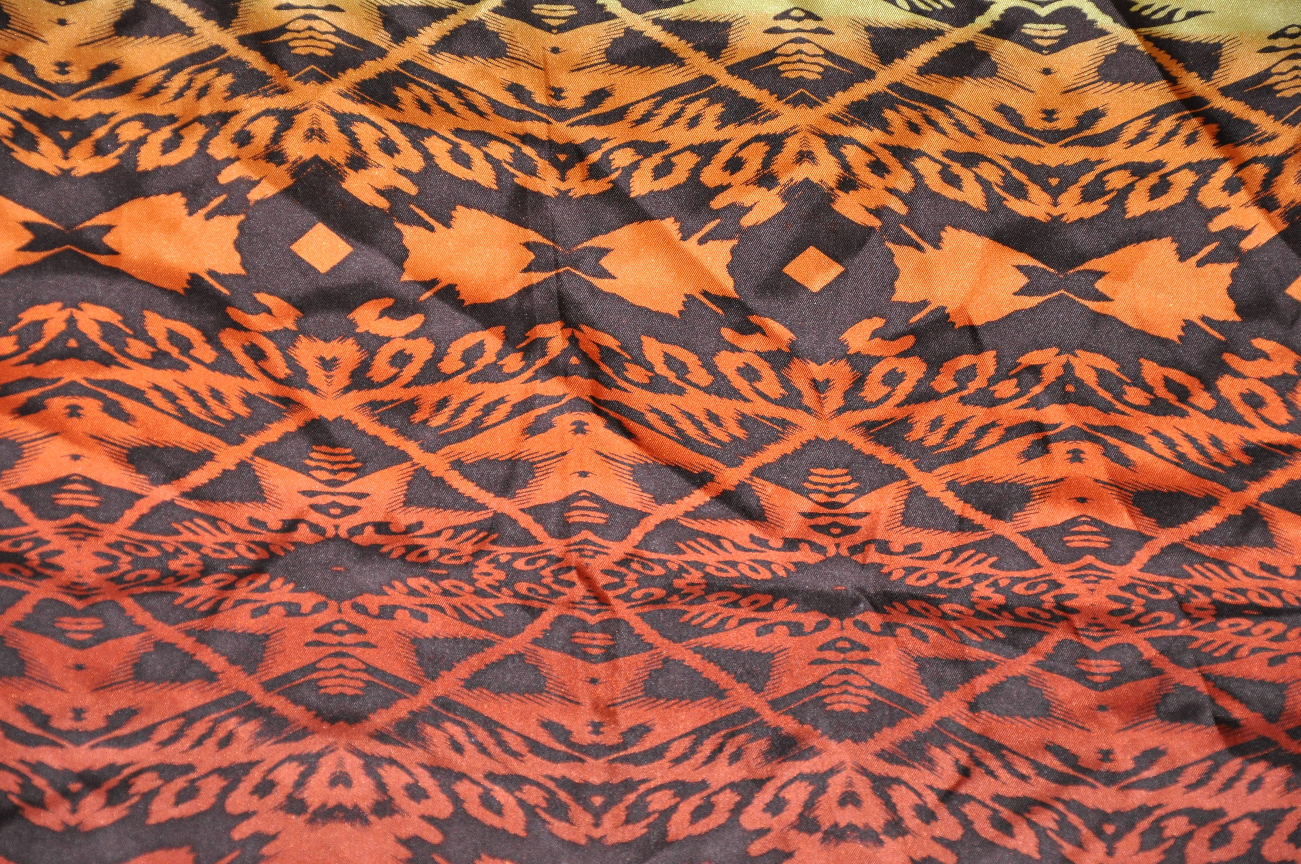 Nicole Miller multi "Autumn Shades" silk scarf measures 34" x 35", and finished with rolled edges. Made in Italy.