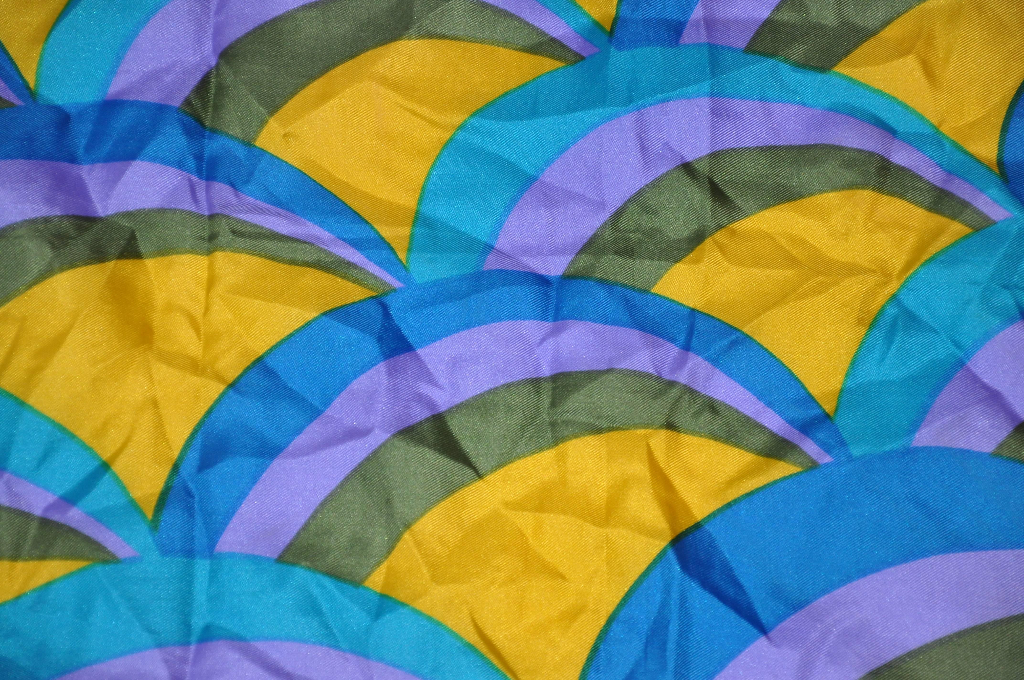 Vera Multi-Lavender, Olive, yellow & Blue silk scarf measures 23" x 24", and finished with hand-rolled edges. Made in Japan.
