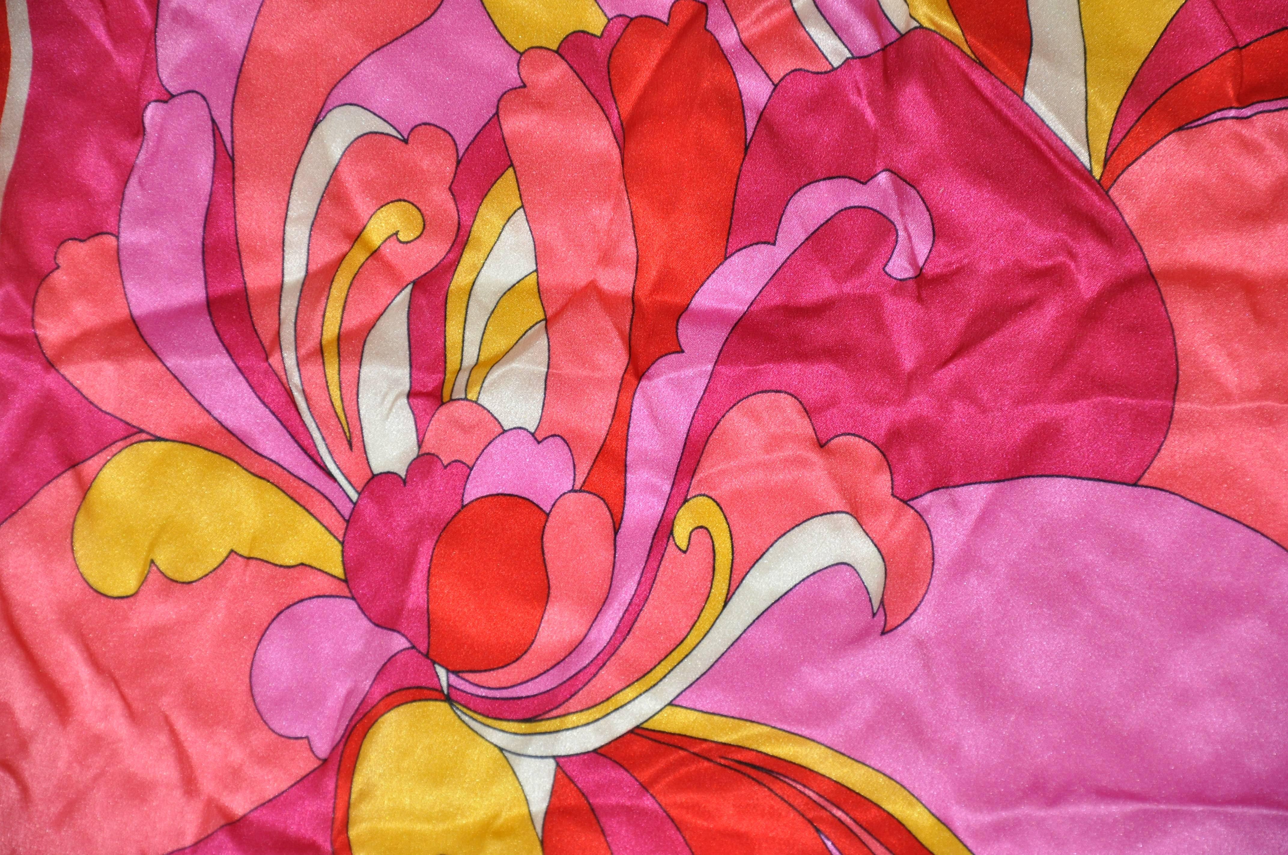 Wonderful vivid colors of reds and fuchsia with white silk scarf measures 21" x 21", and finished with hand-rolled edges. Made in Italy.