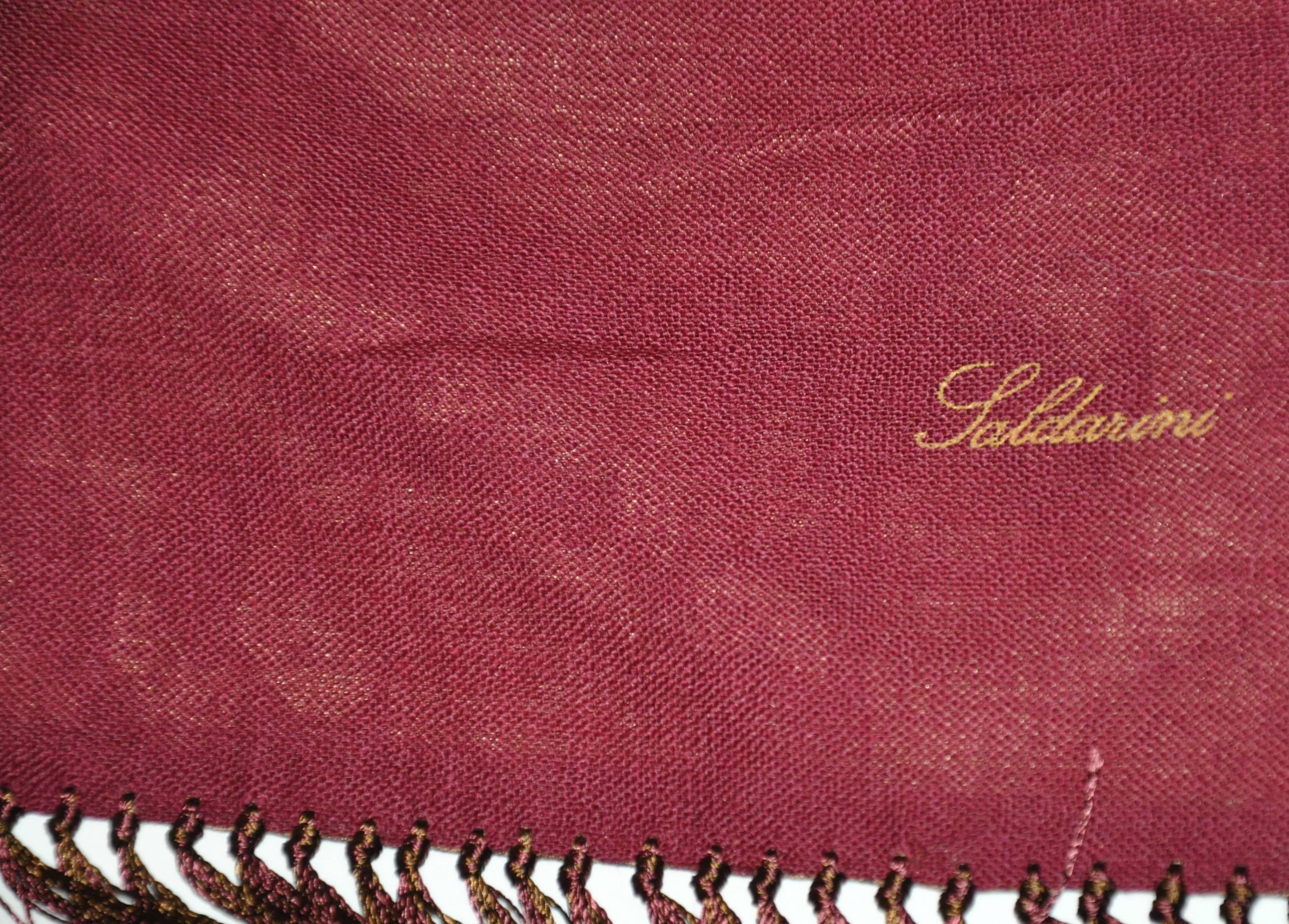 This wonderful combination of silk Palsey and burgundy wool challis accented with hand-knotted silk fringe measures 12