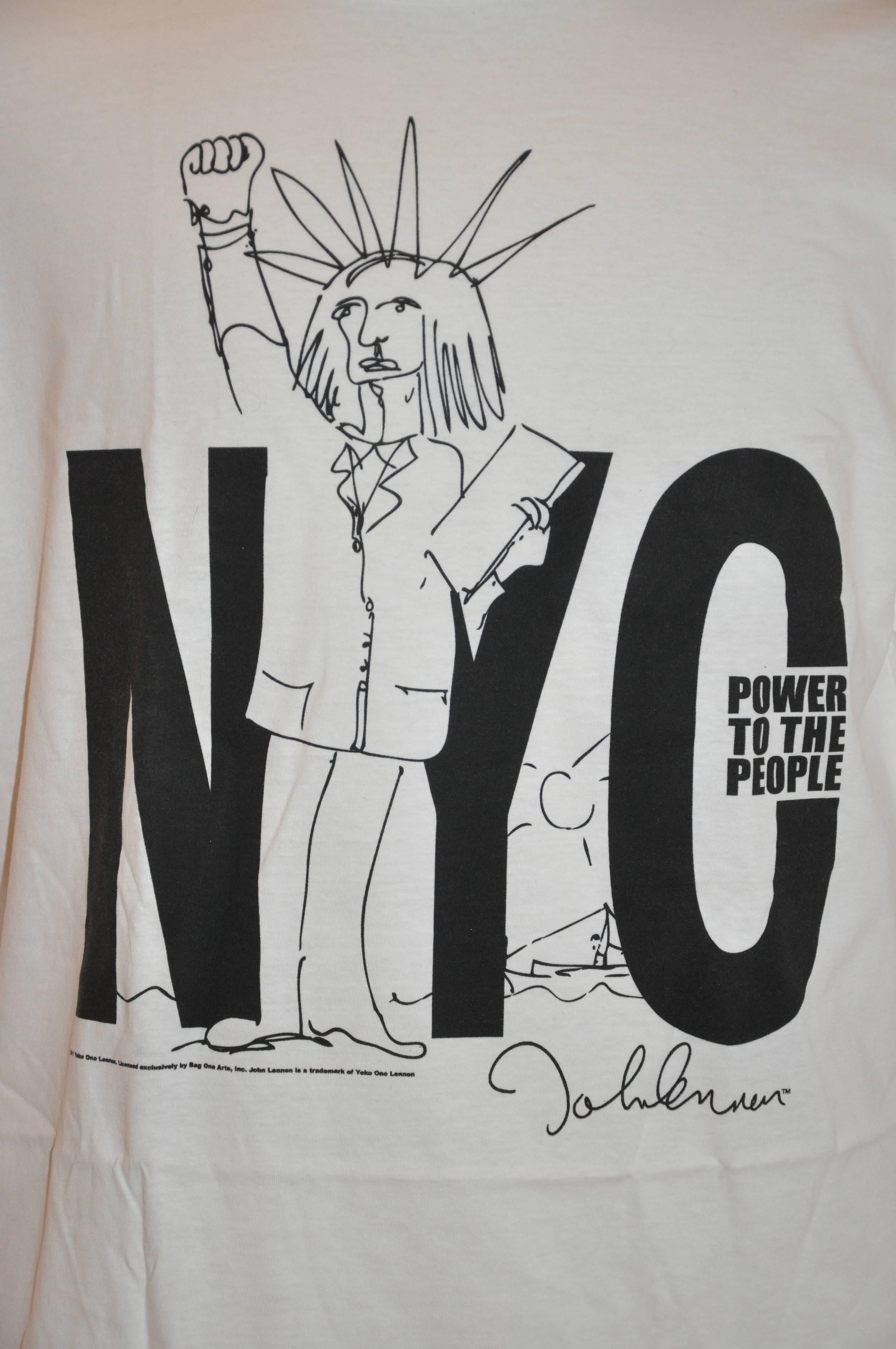 John Lennon "Limited Edition" "Power To The People" with drawing by John Lennon white cotton men's tee measures 22" across the shoulder, length is 30 1/2", underarm circumference is 48 1/4". Size is ex-large.
