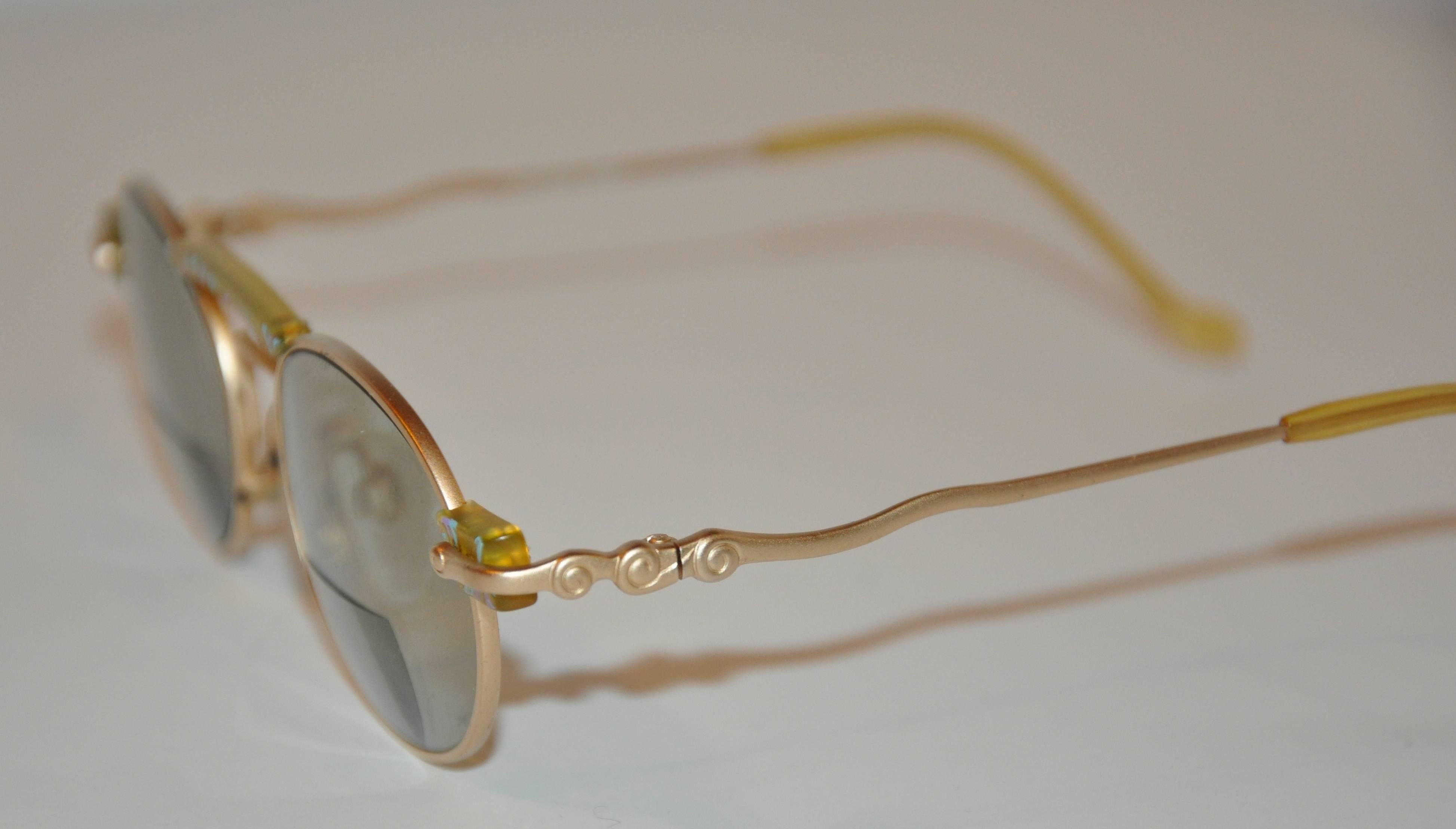 Kansai Yamamoto wonderful matte gold tone hardware prescription lens sunglasses are accented with multi-colors of 