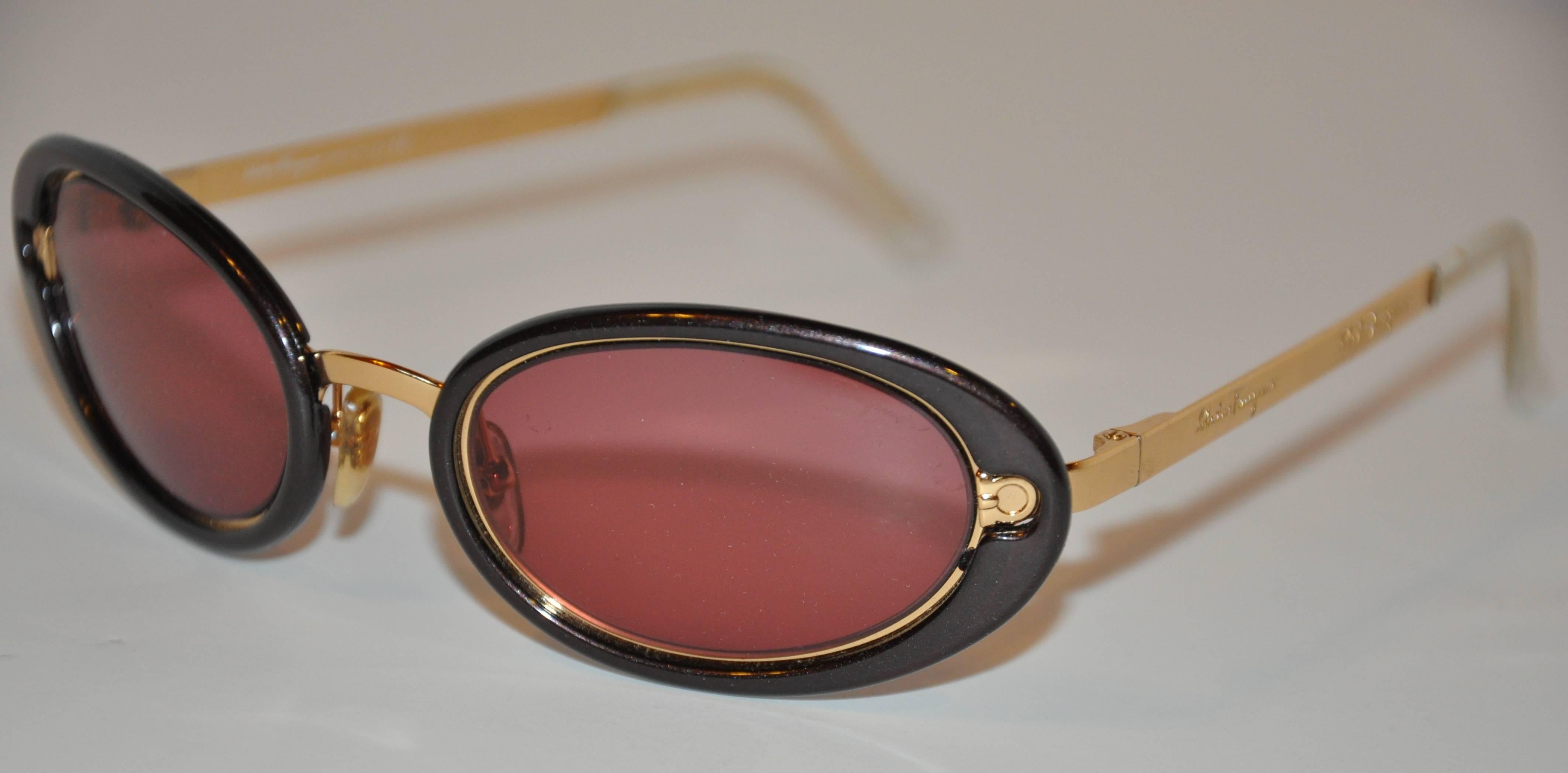 Salvador Ferragamo wonderfully detailed gilded gold tone hardware accented with black lucite overlay measures 5