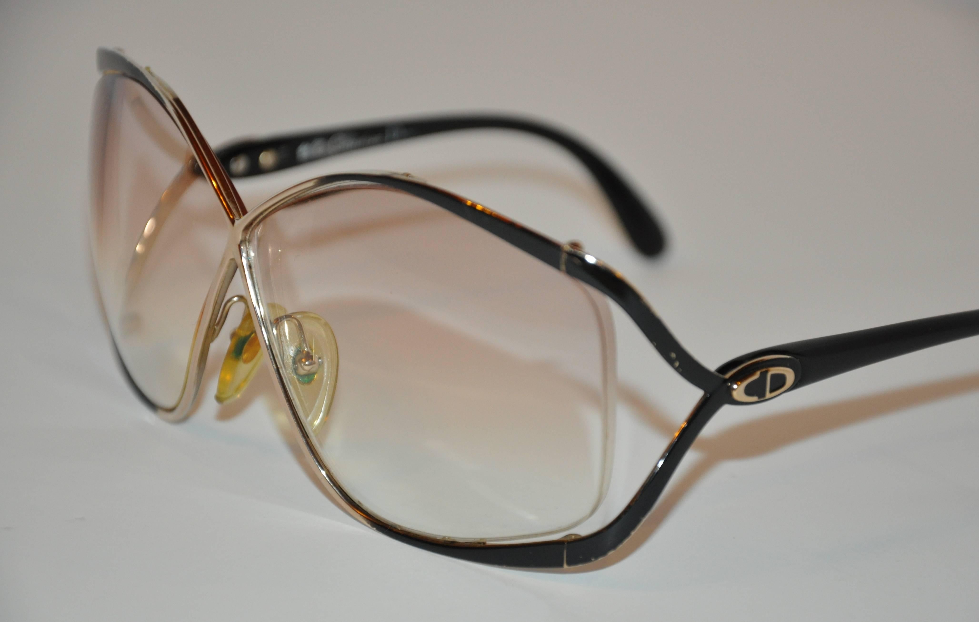These wonderfully huge Christian Dior Gilded gold tone hardware with black lucite overlay id accented with the signature 