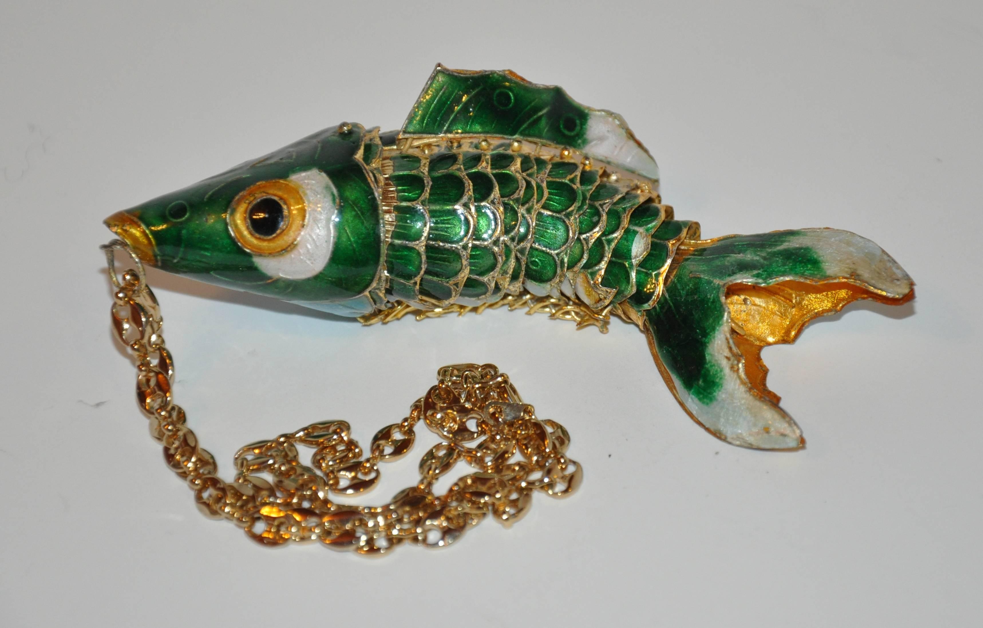 This wonderful whimsical large gold-tone hardware with enamel overlay of greens accented with turquoise and white moveable "Lucky Fish" measures 4 1/2" in length, 1 1/2" in width as well as 1 1/2" in depth. The gold-tone
