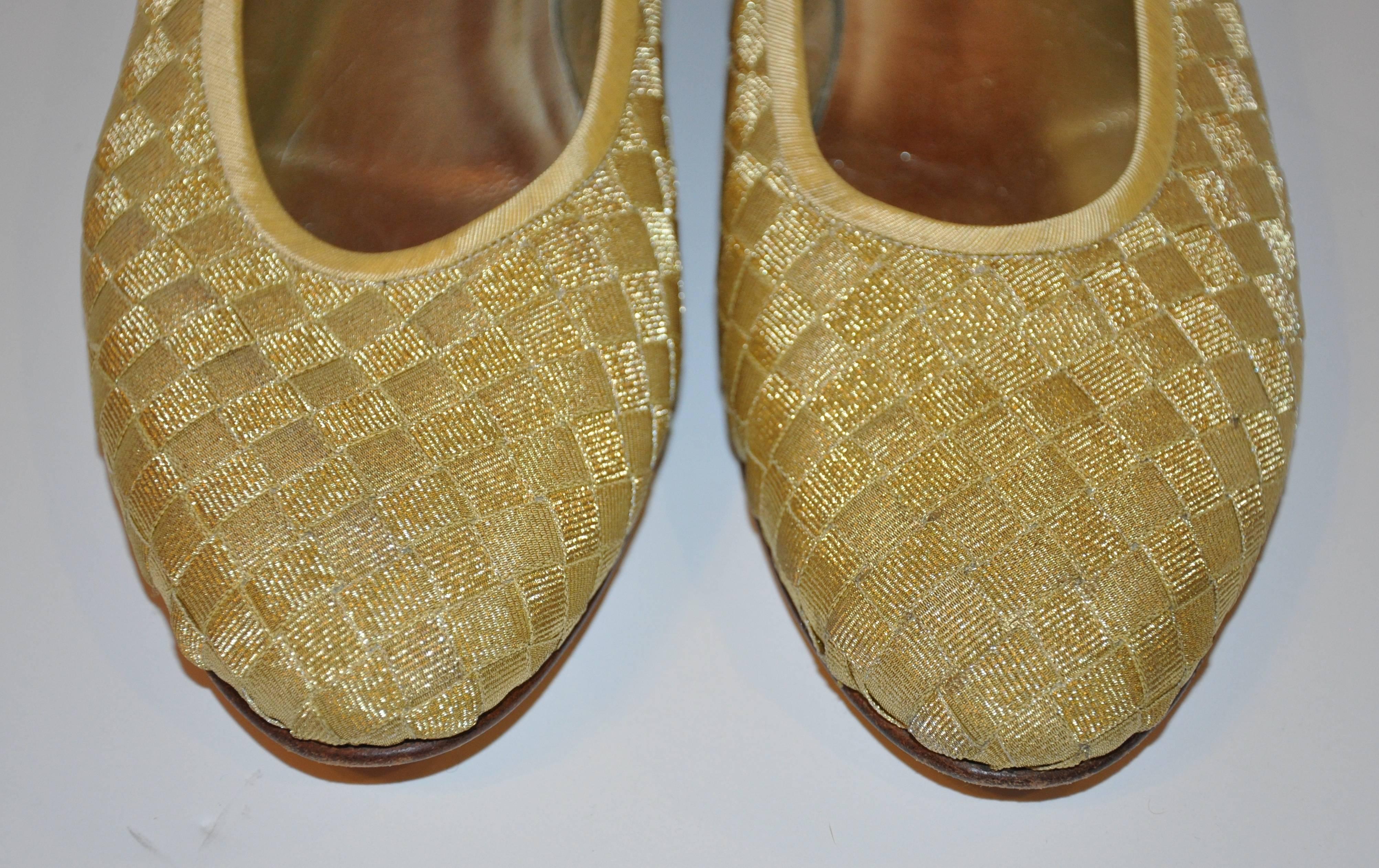 Bottega Veneta wonderfully elegant and timeless signature woven gold lame flats has a slight wedge heel measuring 1/2", finished with gold-covered silk satin as well. Size is 39 1/2/B/Italy. The width of the sole in front measures 3 1/4",