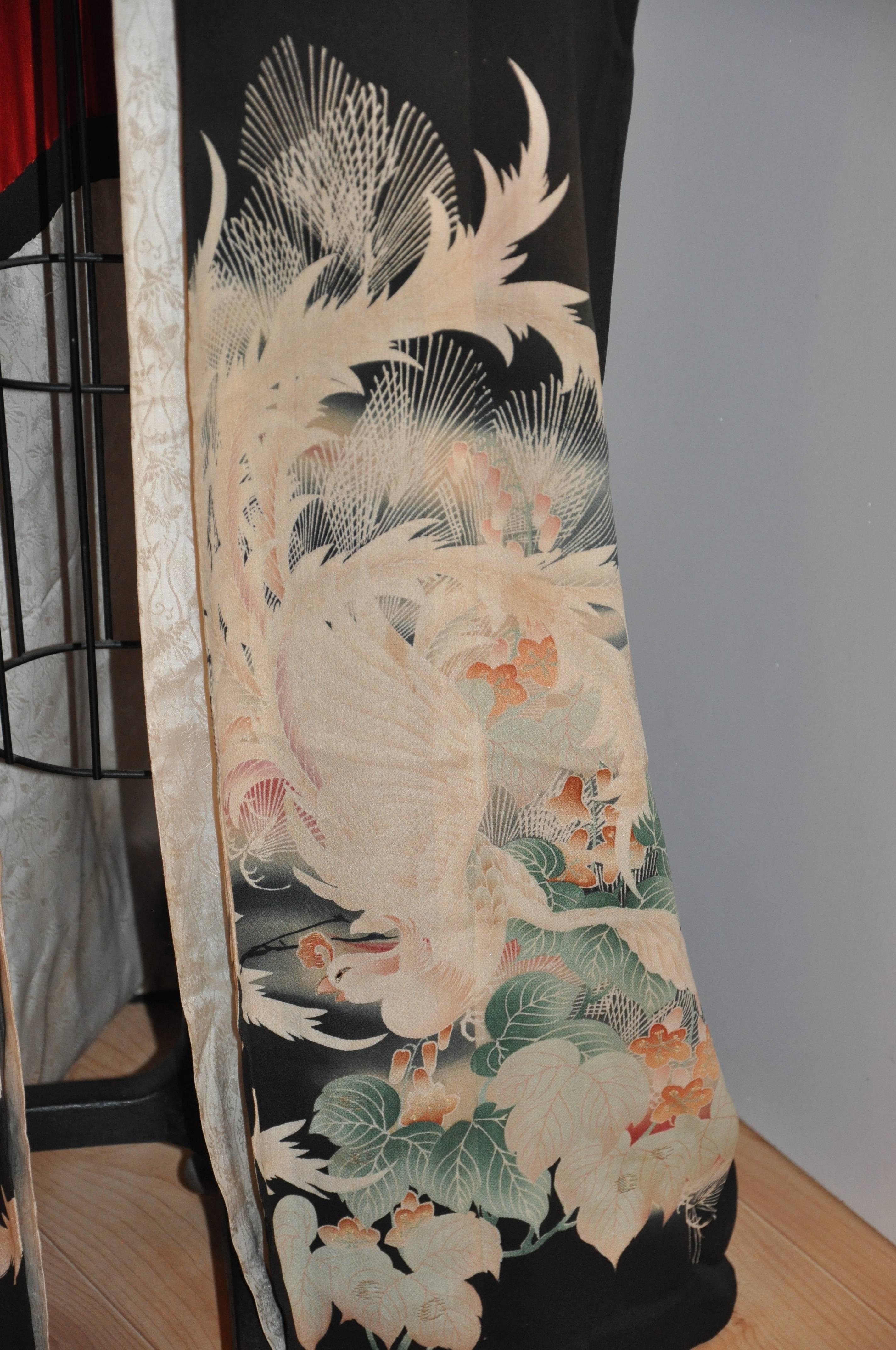 Beautifully detailed black silk kimono with "Pair of Birds in Garden" kimono measures 60" in total length, underarm circumference is 52", collar width is 4 3/4", neck-to-sleeve's cuff is 20", sleeve's length is 19