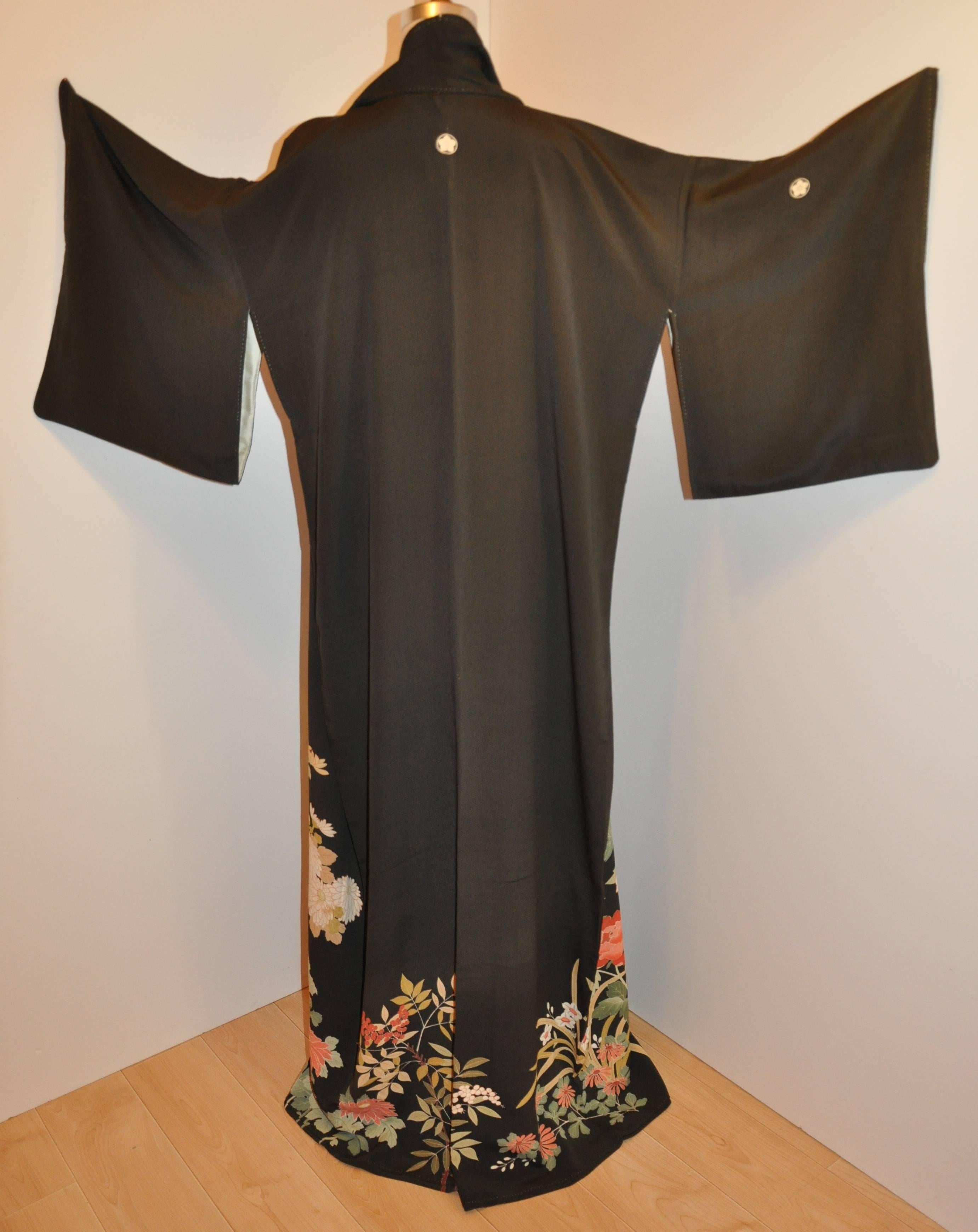      This wonderfully detailed black silk kimono with multi-colors of 