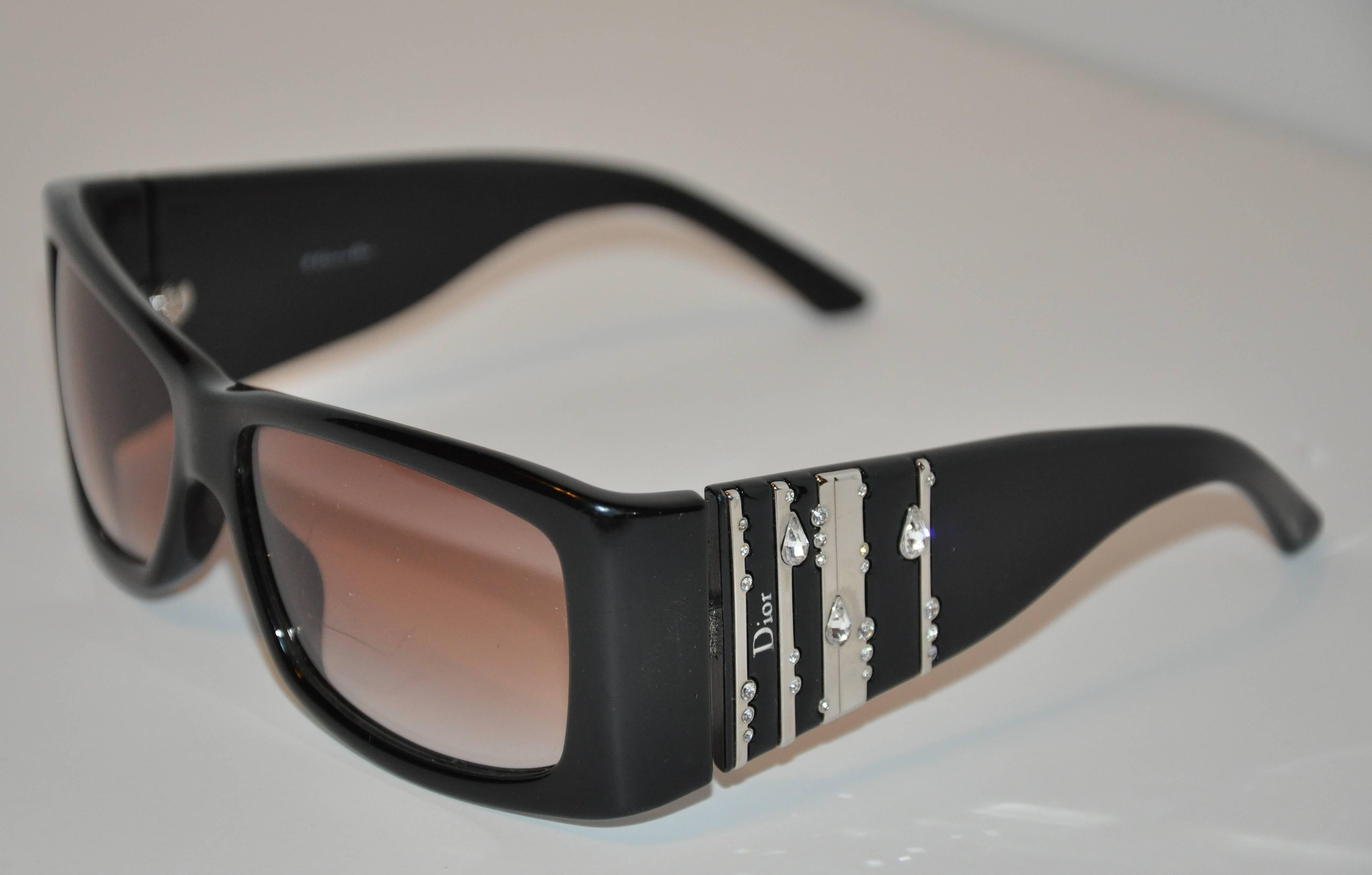        Christian Dior wonderfully detailed "Limited Edition" thick black lucite frames are highlighted with polished silver hardware combined with droplets of rhinestones on the arms. The length across the front measures 5 1/2",