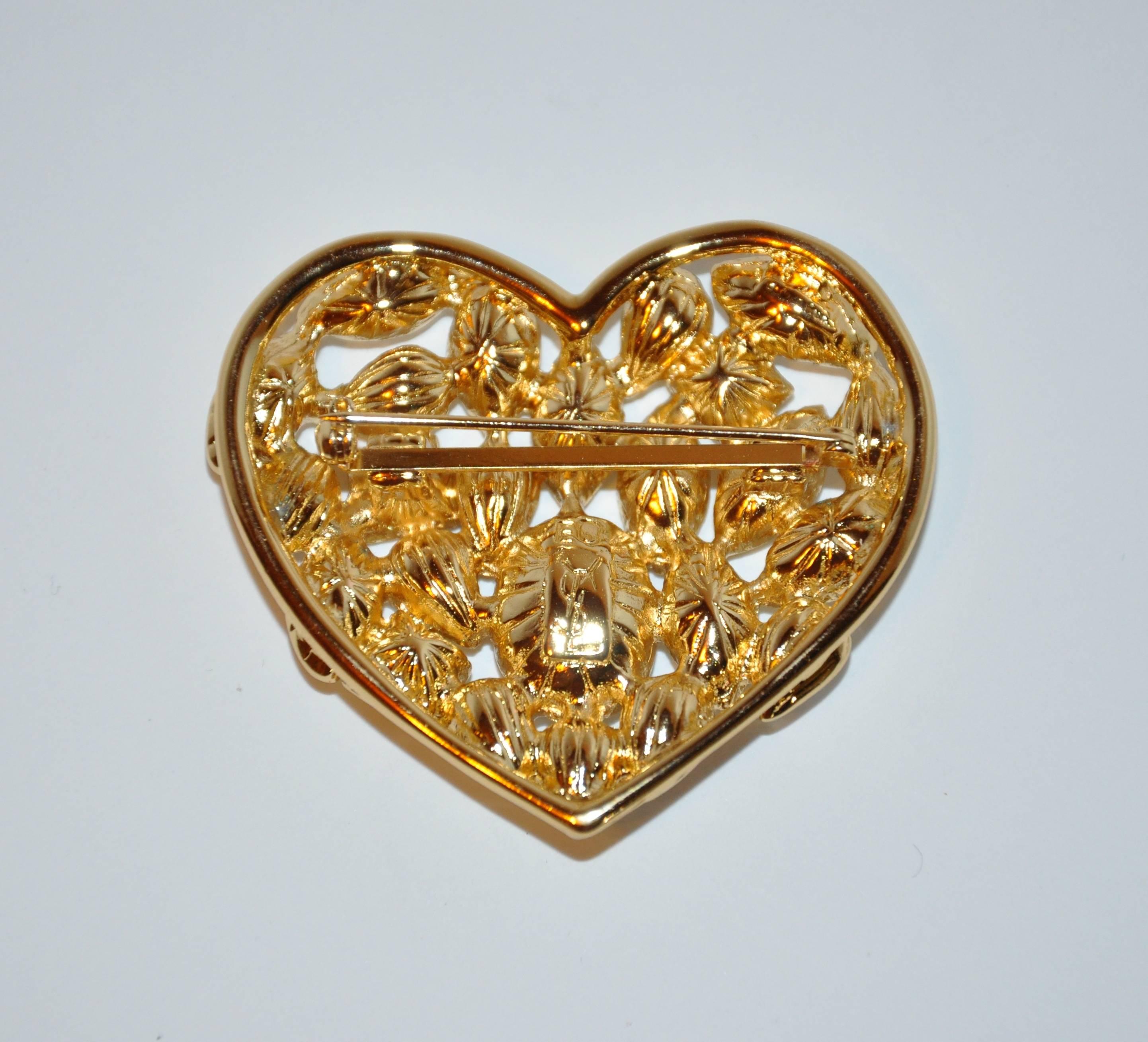         Yves Saint Laurent wonderfully elegant yet whimsical "Hearts to Hearts" huge multi-rhinestone brooch set in gilded gold hardware measures 2" in width as well as in length. Made in France, with original box.
