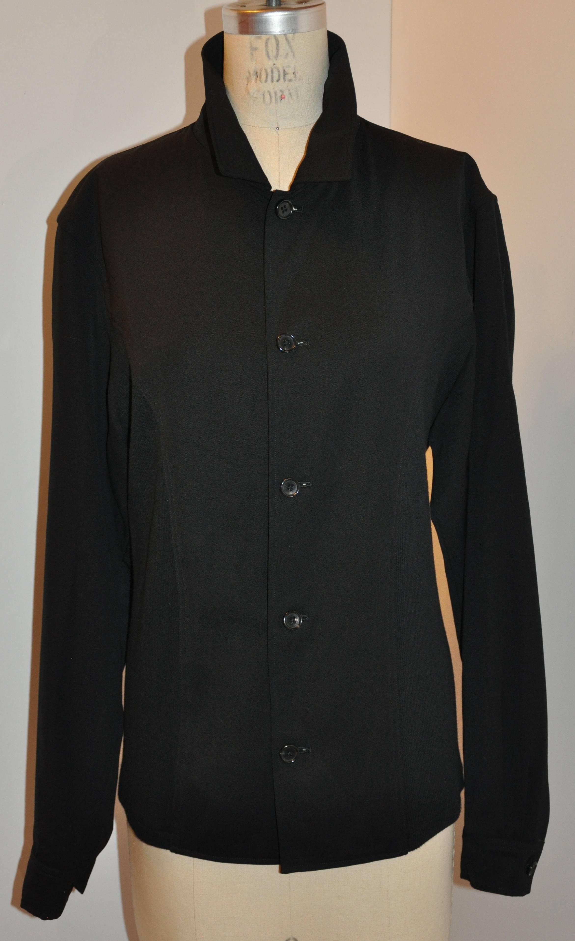        Yohji Yamamoto homme men's black bottom-front jacket is detailed with black micro-ribbed merino wool panel on the sides as well as on the back. The front has five buttons as well as on the sleeve's cuff. Made of 95% cotton with 5% poly