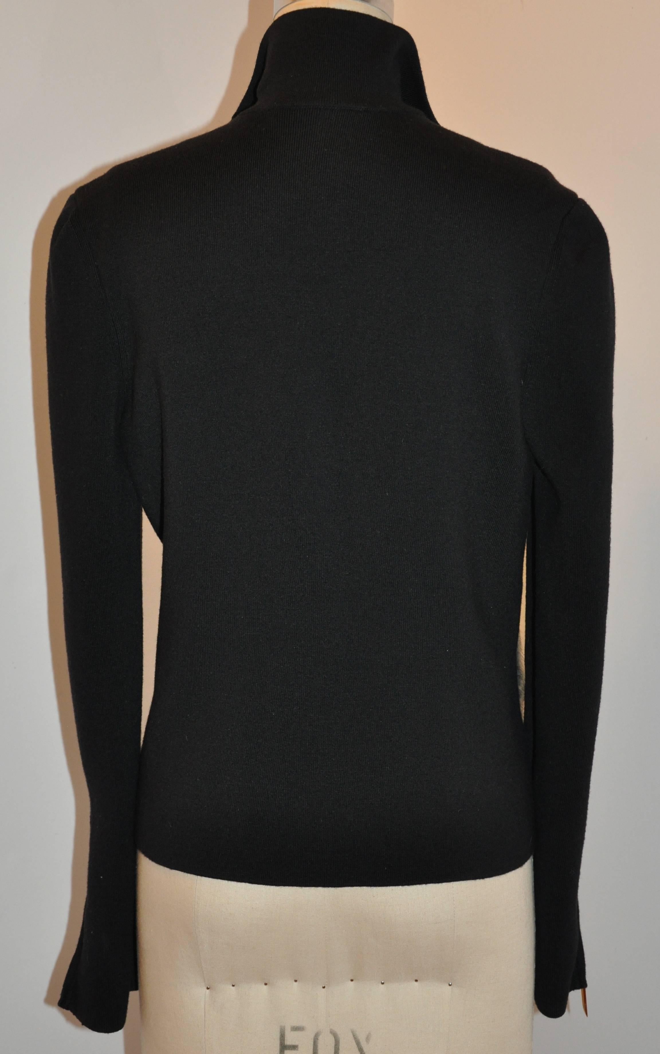        Gucci's wonderfully timeless and simply elegant black stretch zipper jacket of 70% merino wool, 20% silk and 10% cashmere, accented in front with Amster fur. The high collar measures 3 1/4" in height. The front, as well as both sleeve's