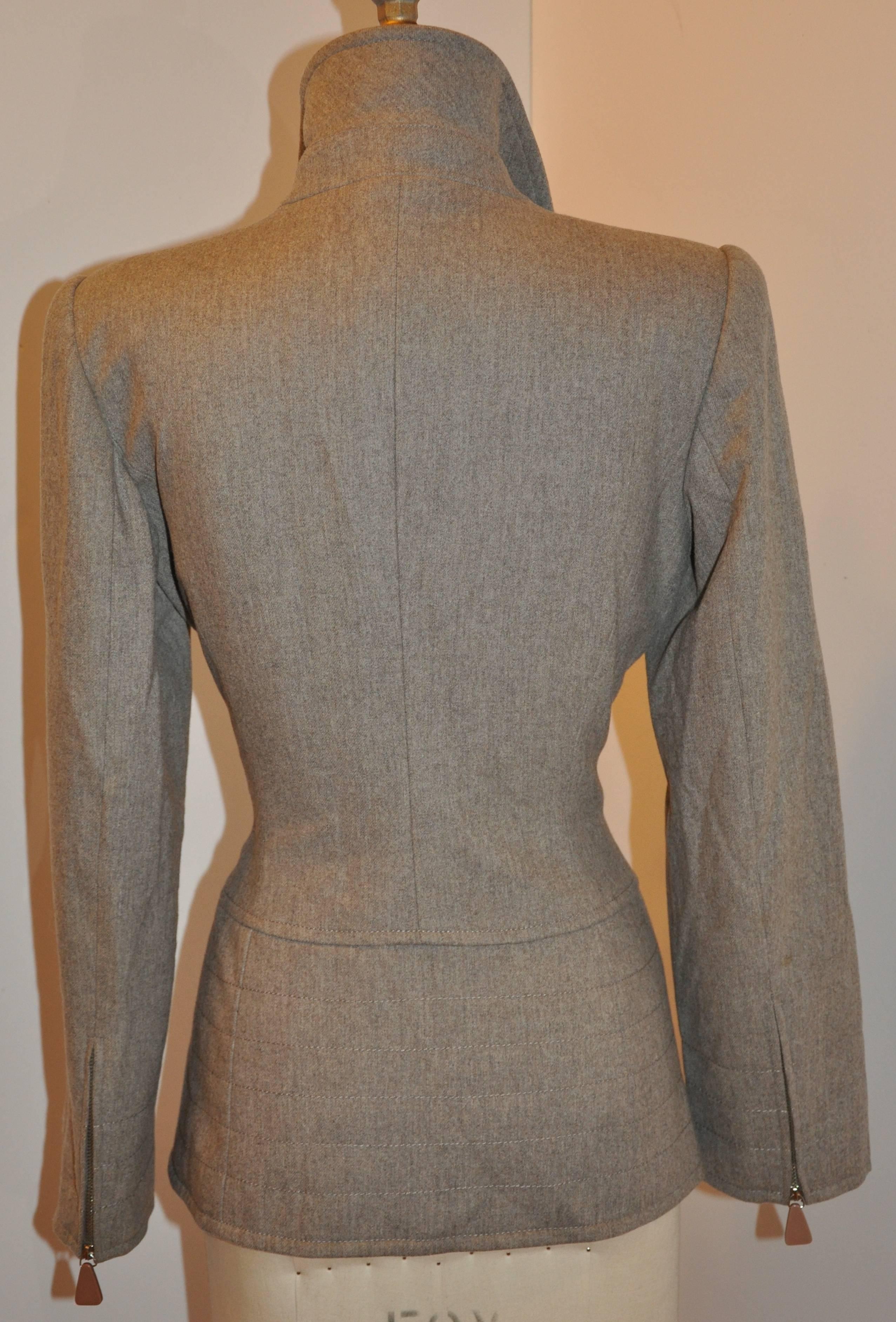        Claude Montana brown-taupe high-collared zippered-front jacket is detailed with top stitching along the lapels, sleeve's cuff, as well as the lower bodice near the hemline. The front zipper is the length of the lower bodice which measures 8