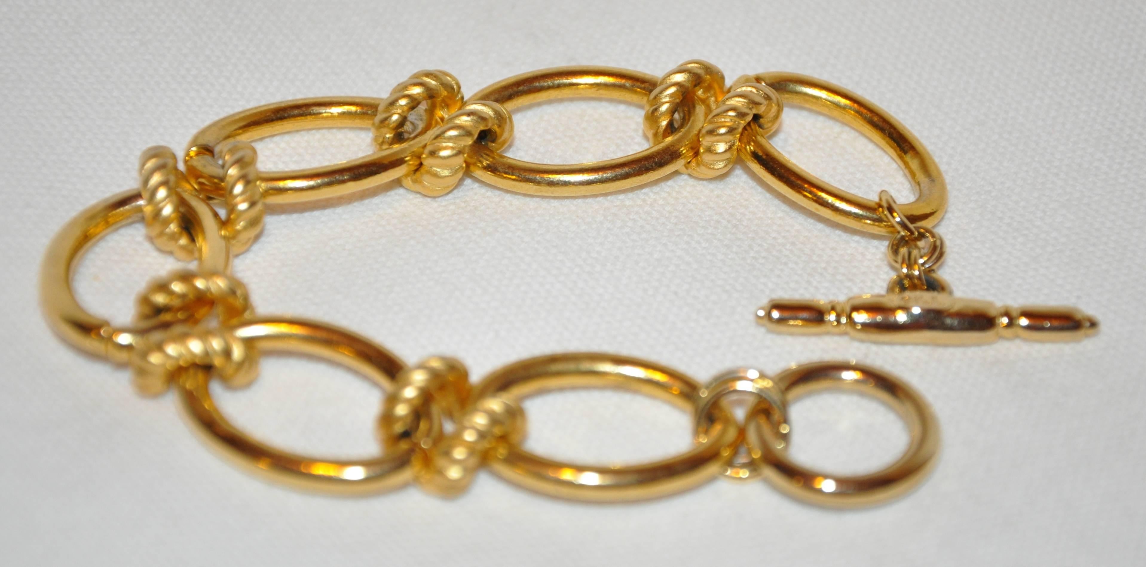        Kenneth Jay Lane wonderful combination of multi-textured as well as glide gold vermeil finish hardware chain-link bracelet measures 8 inches in length and 6/8 inch in width. Made in United States.