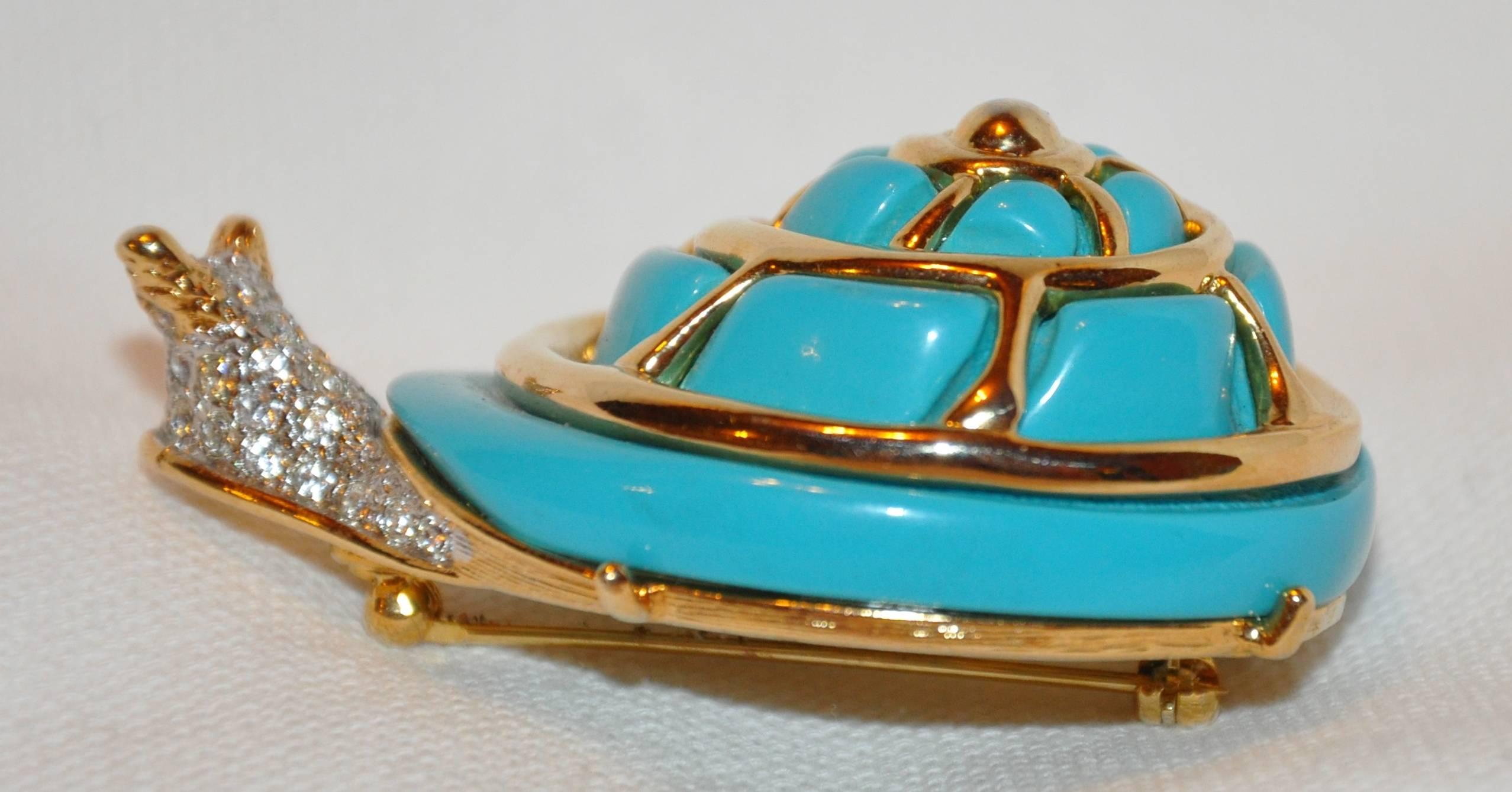       Kenneth Jay Lane wonderfully huge detailed whimsical "Snail" with faux turquoise set in polished gilded gold vermeil hardware is accented with faux diamonds, and measures 2 3/8" in length and 1 1/2" in width, depth is