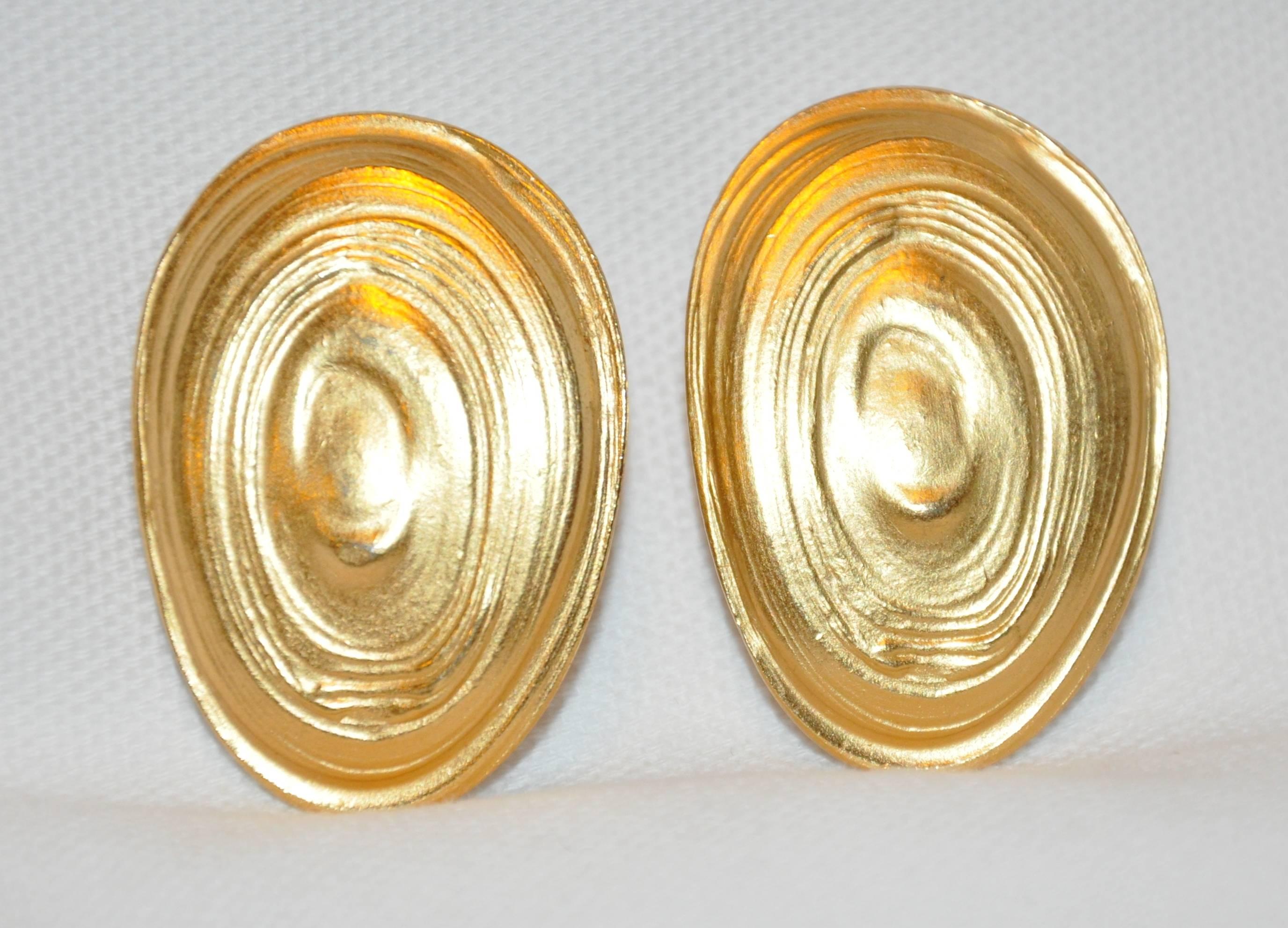          Wonderfully simply yet elegant, these "Limited Edition" "Swirls" gilded gold vermeil hardware by Konio Yelamamo for Trifari measures 1 1/2" x 1". The back is etched with both Konio as well as Yelamamo, Made in