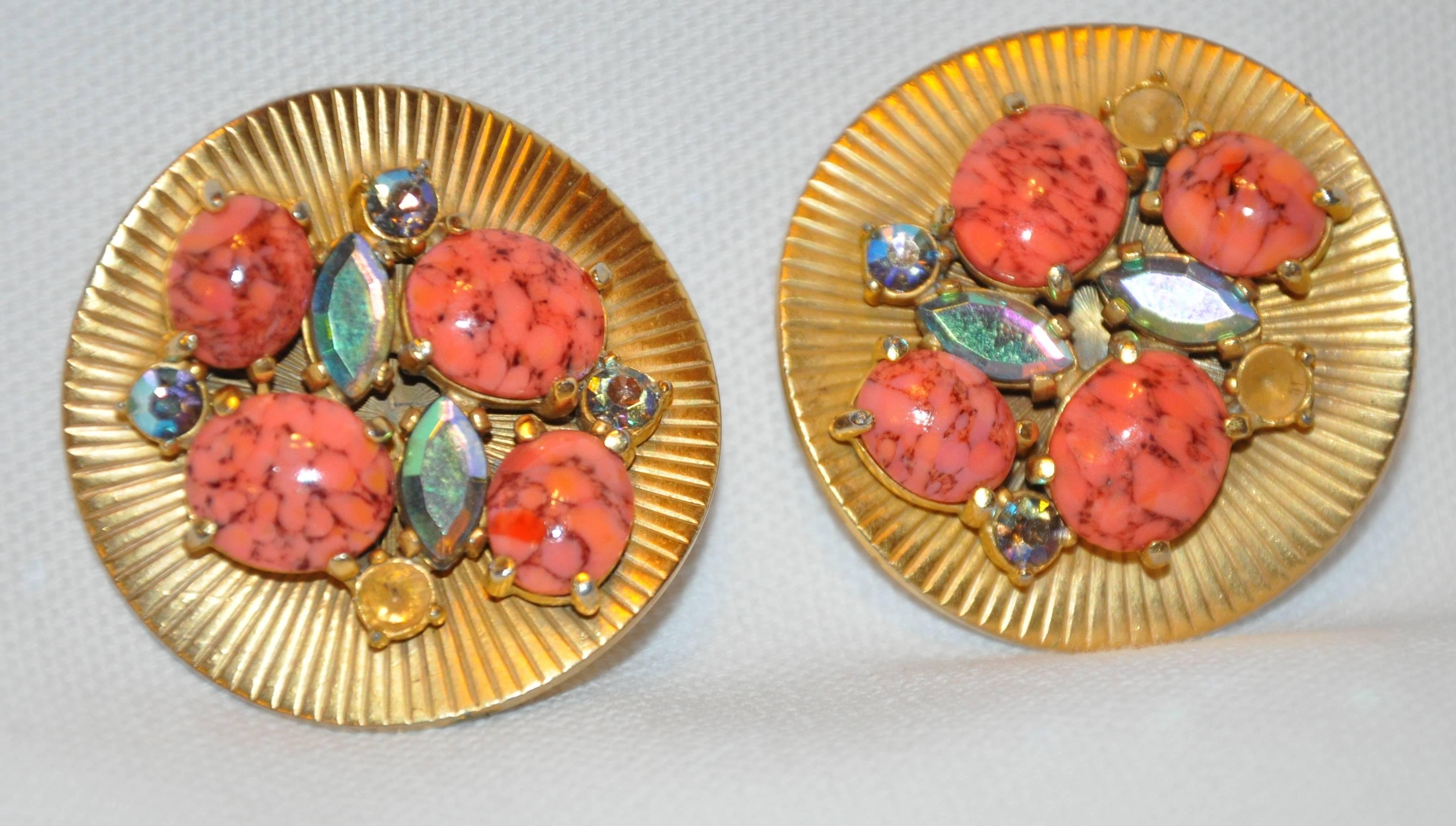        Schiaparelli Wonderful whimsical large textured gilded gold hardware as well as gilded polished gold hardware is accented with multi-colors of faux corals and faux gemstones, both in shapes of round and ovals. The clip-on earrings are missing