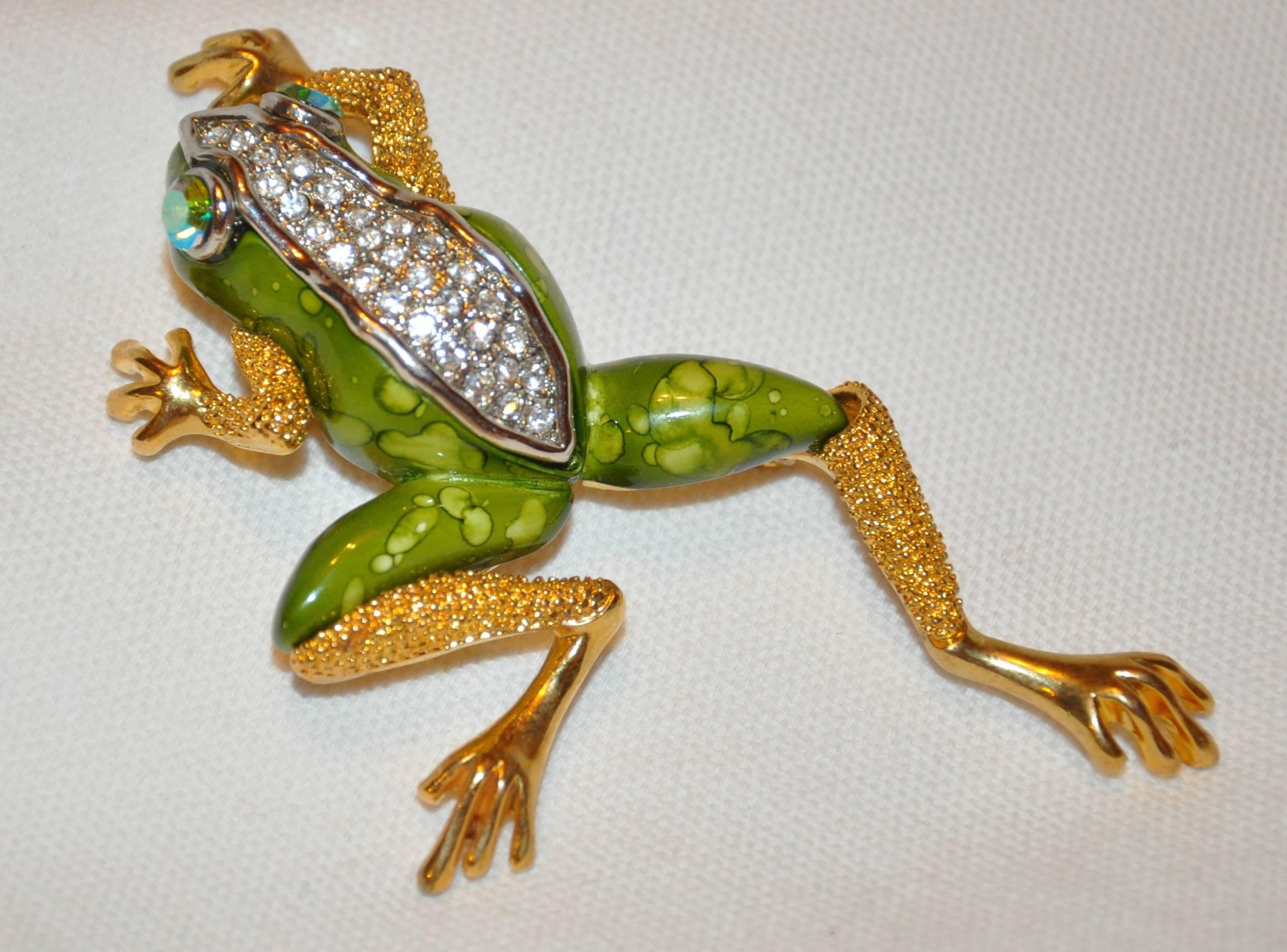      This wonderfully huge whimsical "Frog" in polished gilded gold vermeil hardware accented with multi-colors of green baked enamel measures 3 3/4" in length, width is 2", depth is 3/4". Made in United States.