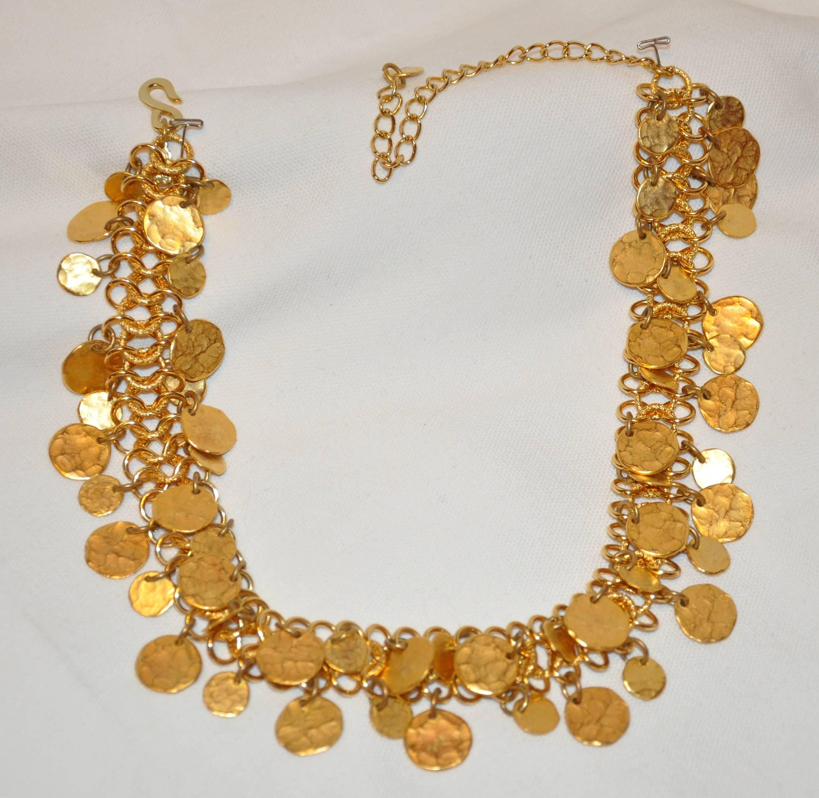         Kenneth Jay Lane wonderfully whimsical hammered gilded gold hardware multi-disc chain-link adjustable necklace measures from 15" - 20" in total length depending on one would like to wear. The width measures 6/8", made in