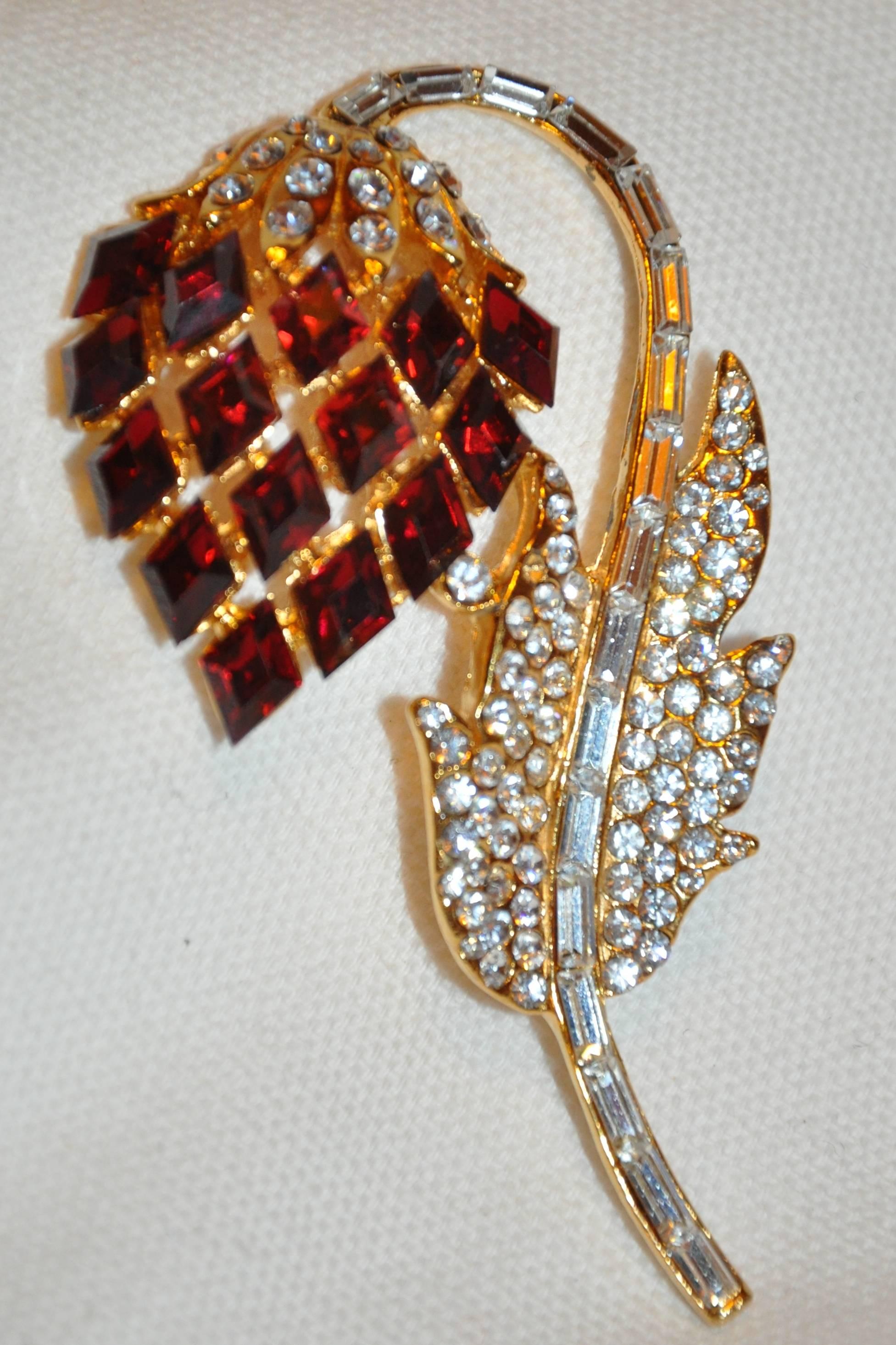      This magnificent Floral brooch, originality used as a brooch, now, as a pendant, can be hung through the loop of the floral stem. Set with magnificent faux brilliant rubies & faux diamonds, the length measures 2 6/8", width is 1