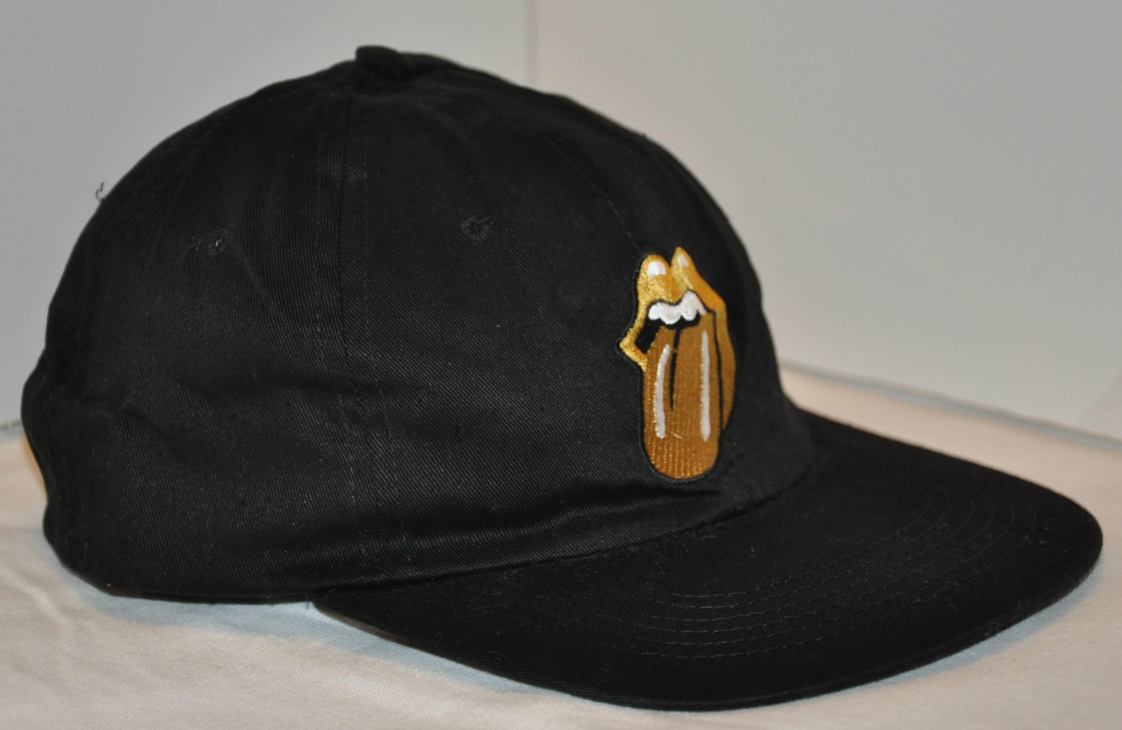        The Rolling Stones  1997 World-Wide "Road To Babylon Concert Tour black cotton cap has their signature "Sticky Tongue" in front. The center back has their "Road To Babylon" embroidered, with adjustable straps as well.