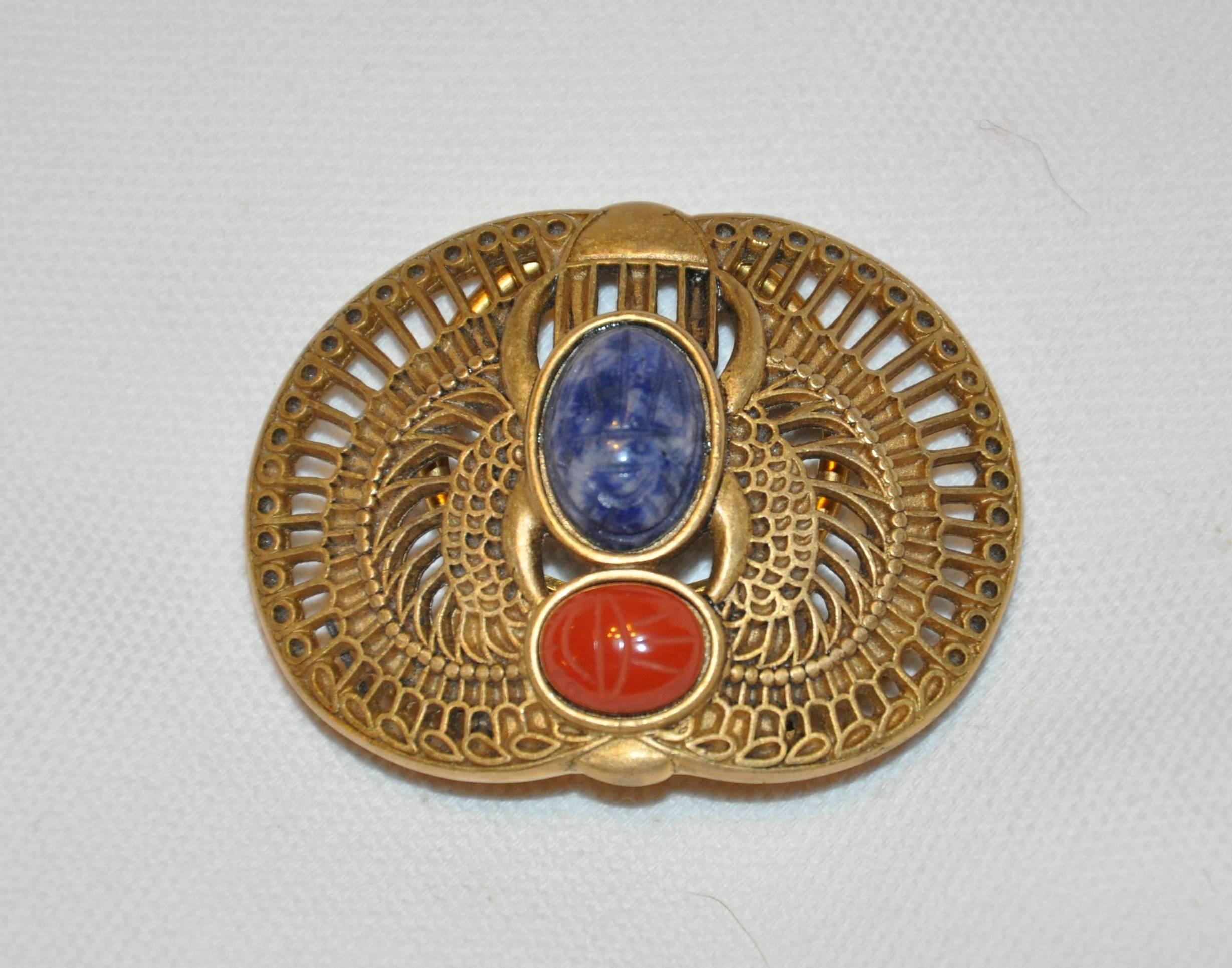     Wonderfully detailed, Mary McFadden's gilded gold hardware optional "Scarab" clip on brooch, can also be used as a loop to hold in place your lovely silk scarf when worn. The width measures 1 7/8 inch, height is 1 1/2 inch, width is