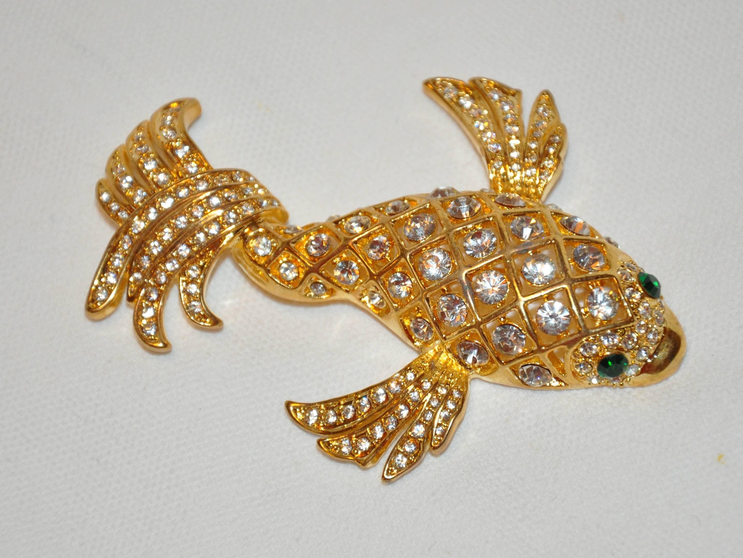        This huge magnificent polished gilded gold vermeil hardware "Lucky Koi Fish" set with multi-sizes of faux diamonds accented with faux emerald eyes make for an impressive brooch. The length measures 3 1/4 inches, width measures 2 1/2