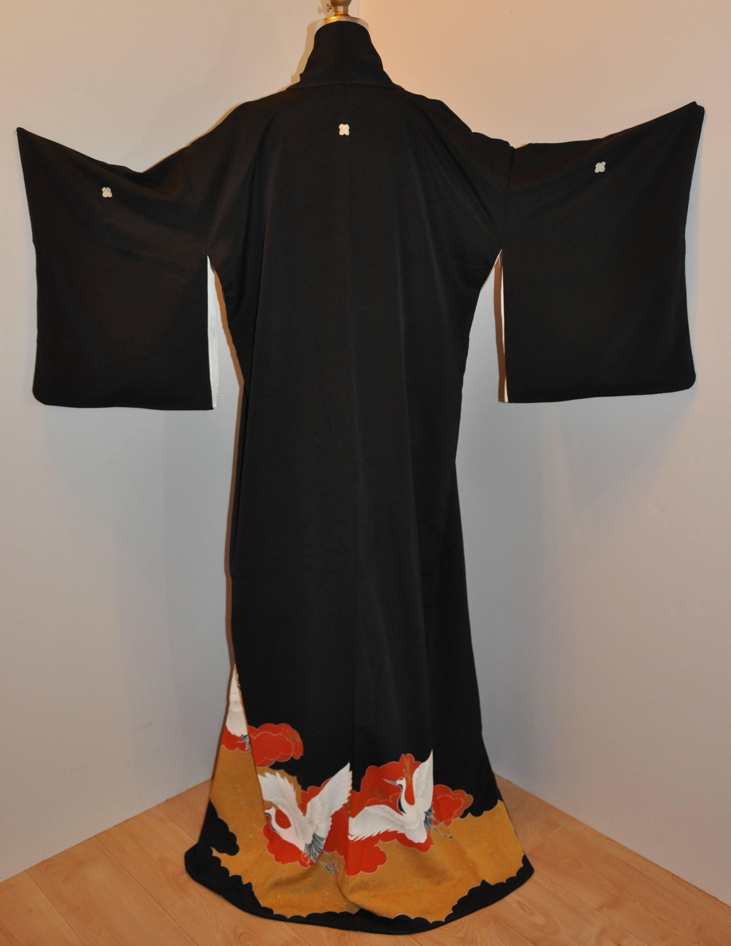         This wonderfully detailed black silk kimono is beautifully accented with 