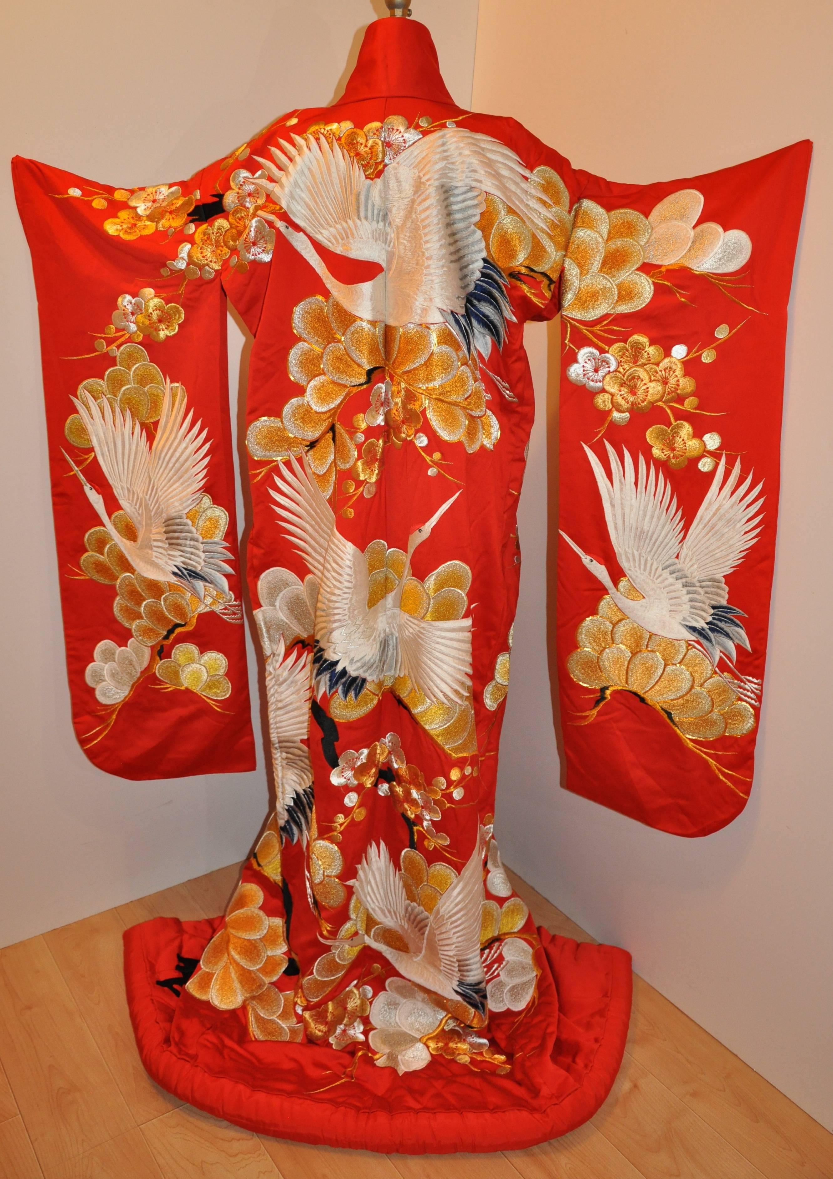        This magnificent and most stunning bold Empress Red Ceremonial silk kimono is wonderfully detailed with multi shades of golden metallic gold lame threads throughout accented with metallic gold lame silk cord. Impressive and stunning in the
