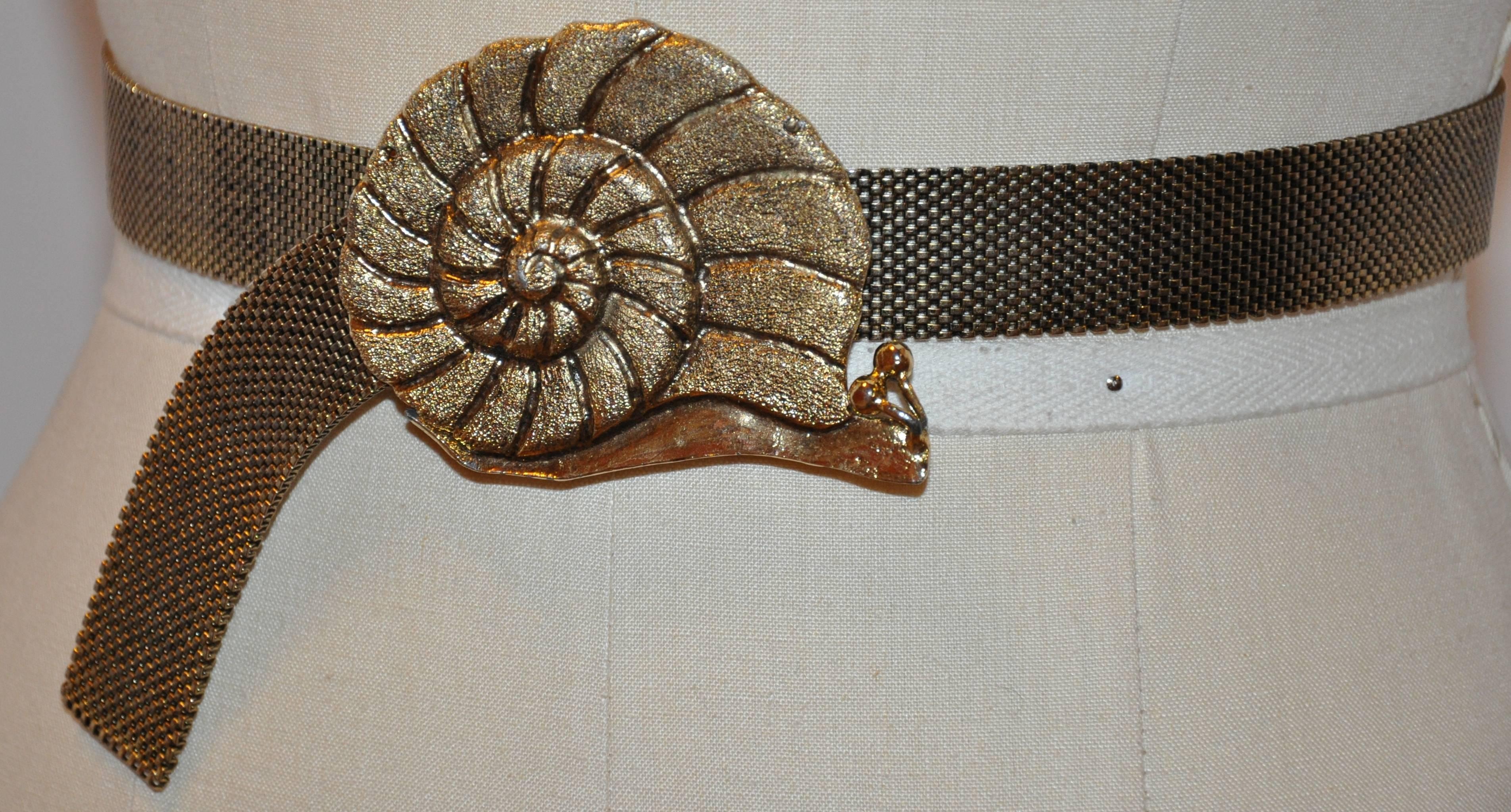        Mr. We's wonderful whimsical "Snail" adjustable belt in gilded gold hardware measures 32 inches x 1 inch. The "Snail" itself measures 3 1/2 inches x 2 1/2 inches.