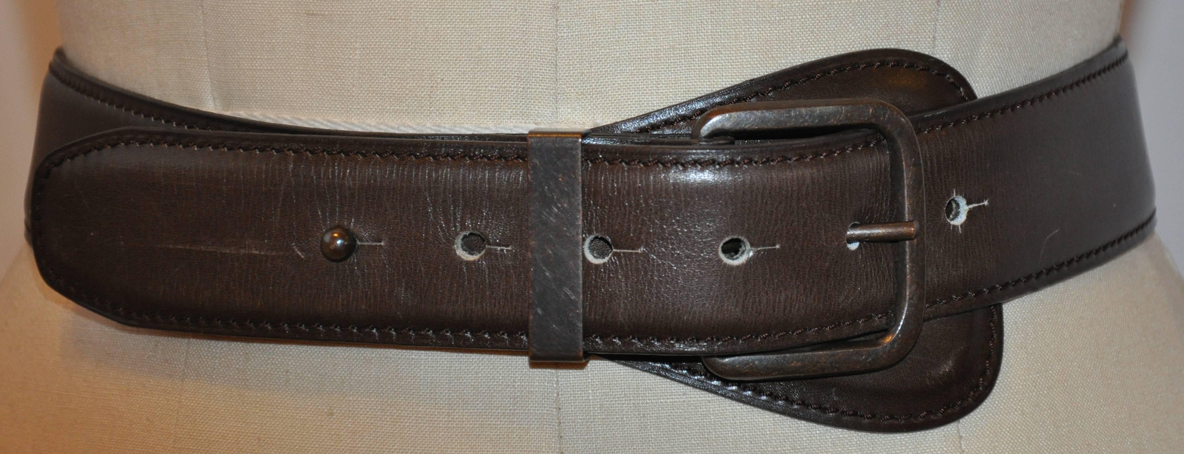      Alaia's wonderful timeless coco brown calfskin leather belt is detailed with brass accents. The leather belt measures 36 inches x 1 1/2 inches. Buckle measures 1 6/8 inches x 2 inches, made in France. There are slight scratches but hardly