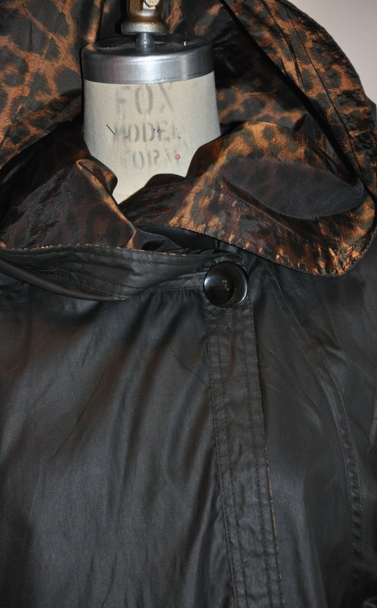 FloorLength Reversible Black and Leopard Print Hooded Raincoat at