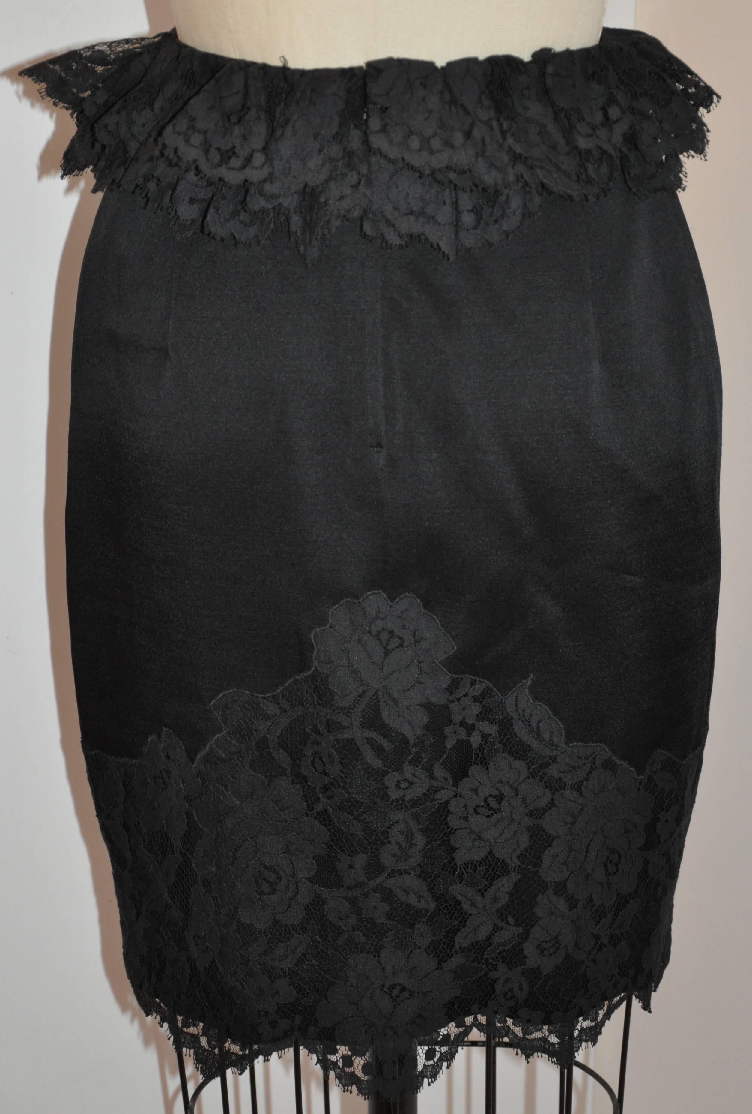    Moschino 'Couture' wonderfully elegant black evening pencil skirt of silk detailed with Swiss lace throughout. The center-back zipper measures 6 1/2 inches in length and finished with a silk covered button as well as a silk loop. Fully lined, the