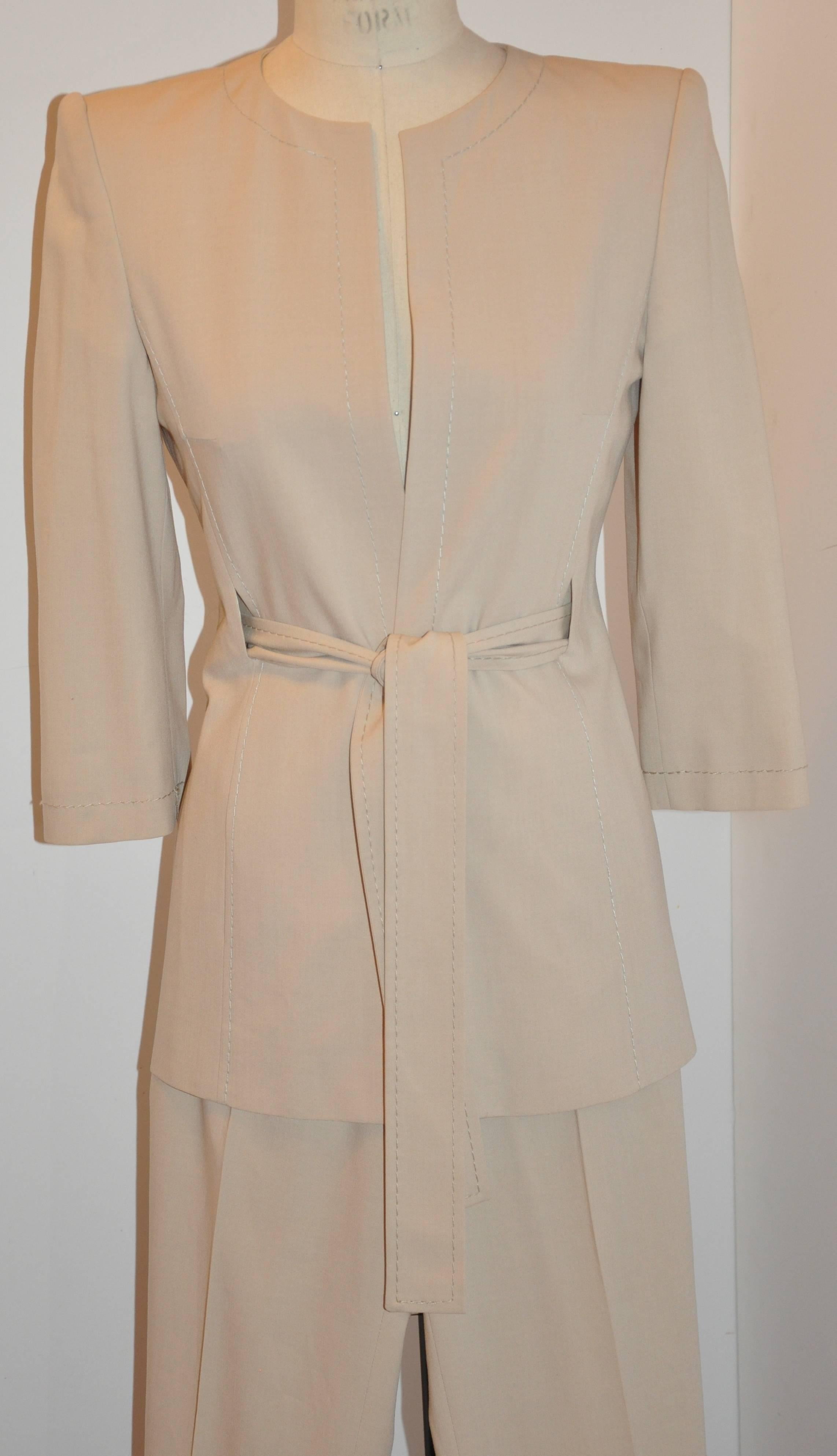       GianFranco Ferre wonderfully detailed silk beige tapered pantsuit with three-quarters sleeves is accented with hand-stitched silk cord along all edges. The self-tie matching belt, which, measures 2 inches by 62 inches can be tied or left