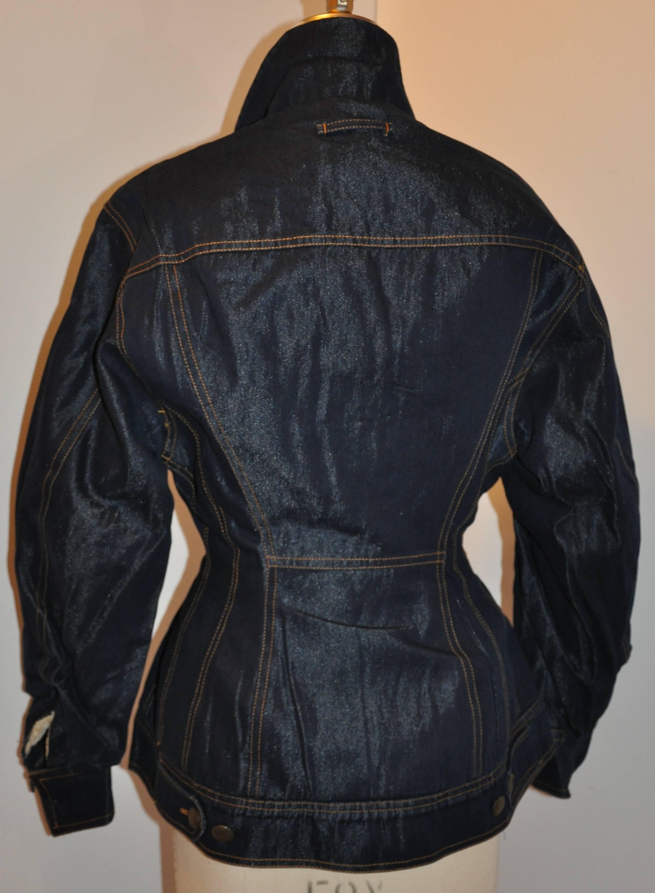     Rare Jean Paul Gaultier sculpted denim jacket with faux leopard collar button jacket is detailed with  double-stitching. The front has two set-in breast pockets with the interior lined with soft faux shearing for extra warmth for those cozy