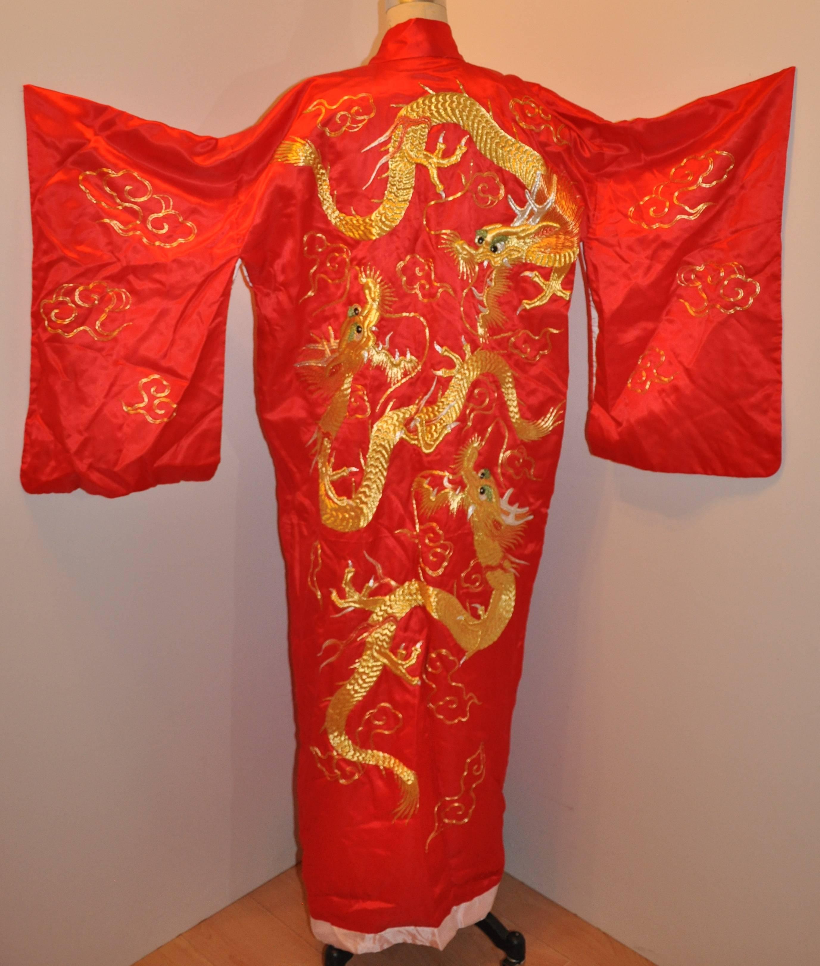      This wonderfully detailed bold Imperial red silk Japanese silk Hayashi kimono features a huge hand-embroidered metallic gold and silver cord 