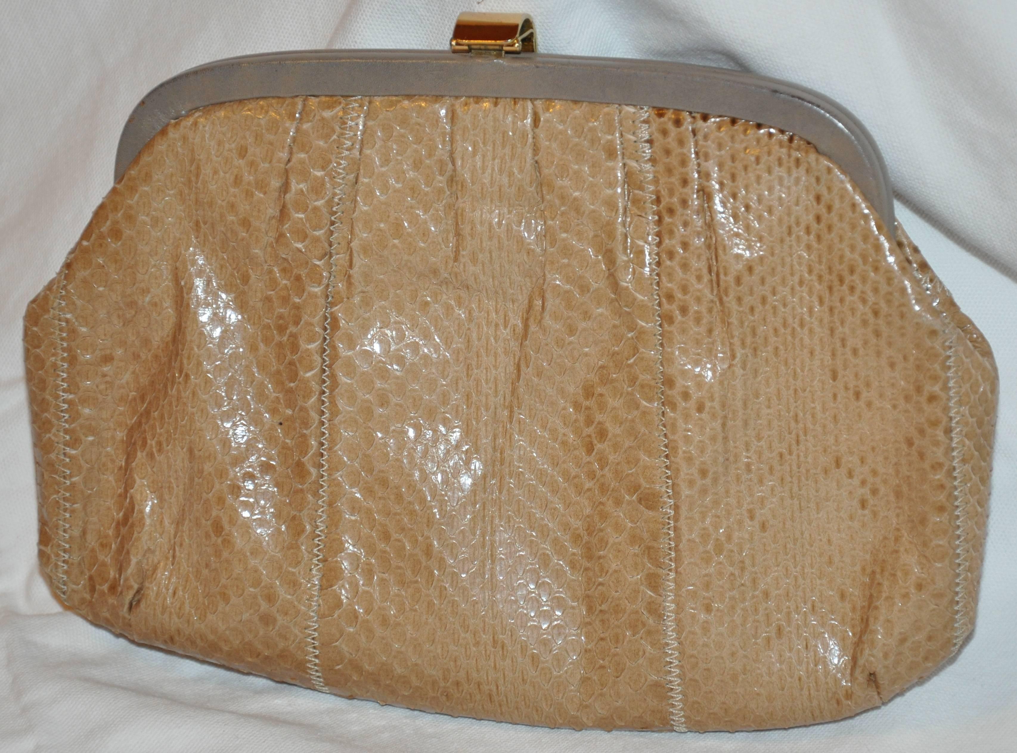 The famed Palizzio of Italy tan snake clutch accented with pale gray calfskin along the top frame as well as the interior measures 9 1/2 inches in length. The height measures 6 1/2 inches, depth is 1 1/2 inches. Optional shoulder straps measures 42