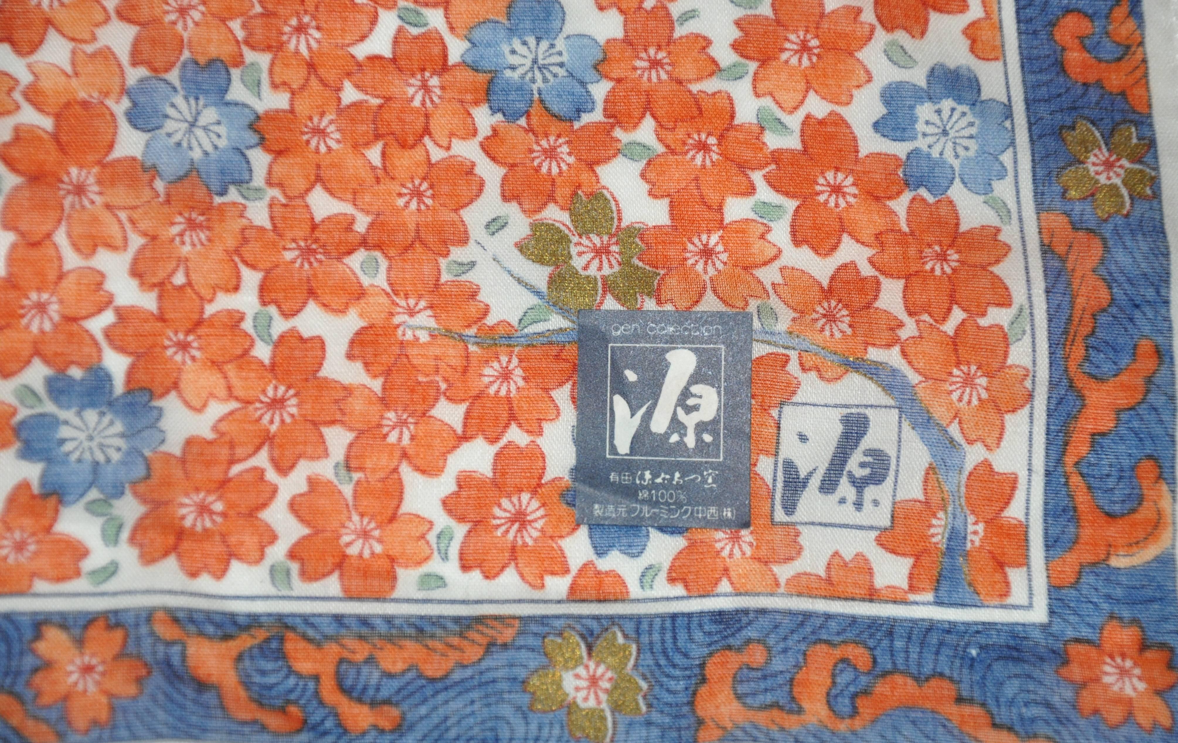        This wonderfully delicate Japanese multi rose and navy floral cotton scarf accented with rolled edges, measures 19 inches by 19 inches. Original sticker attached near corner. Made in Japan.