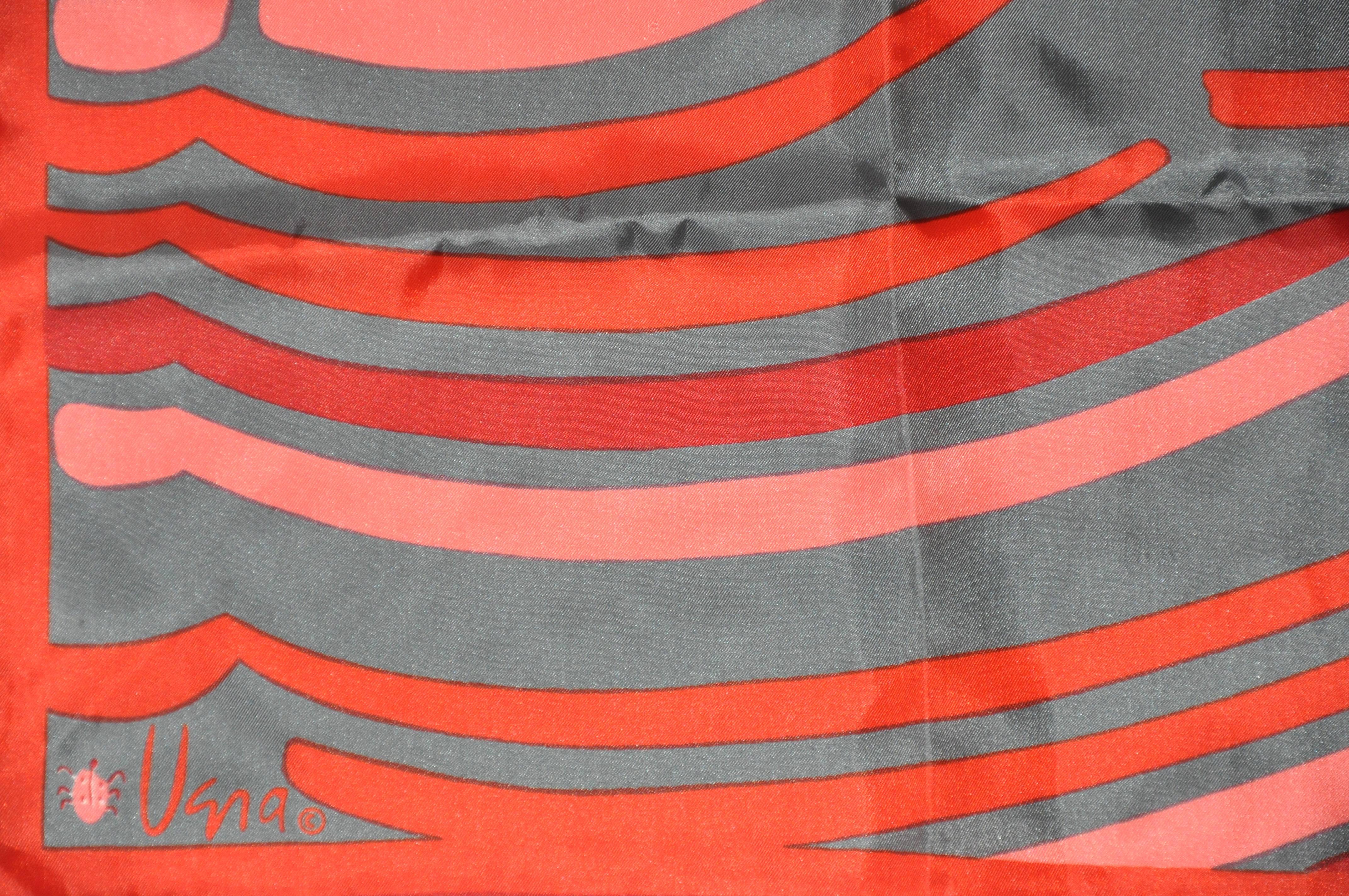        Vera wonderful shades of rose and gray multi-abstract stripe scarf of polyester accented with rolled edges, measures 14 inches by 43 inches.
