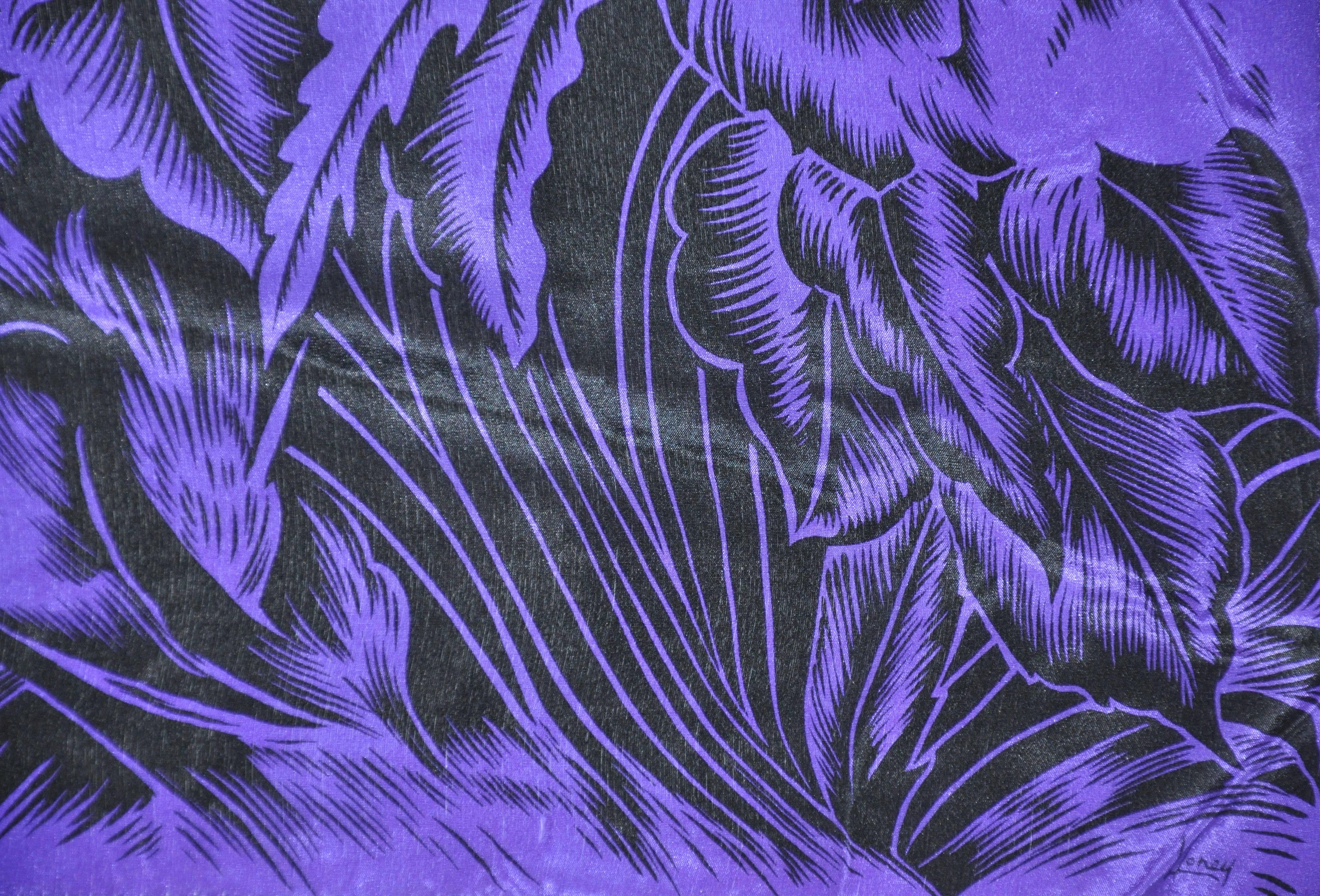 Honey wonderfully rich violet and black Bursting florals silk scarf accented with hand-rolled edges, measures 14 inches by 64 inches. Made in Japan.
