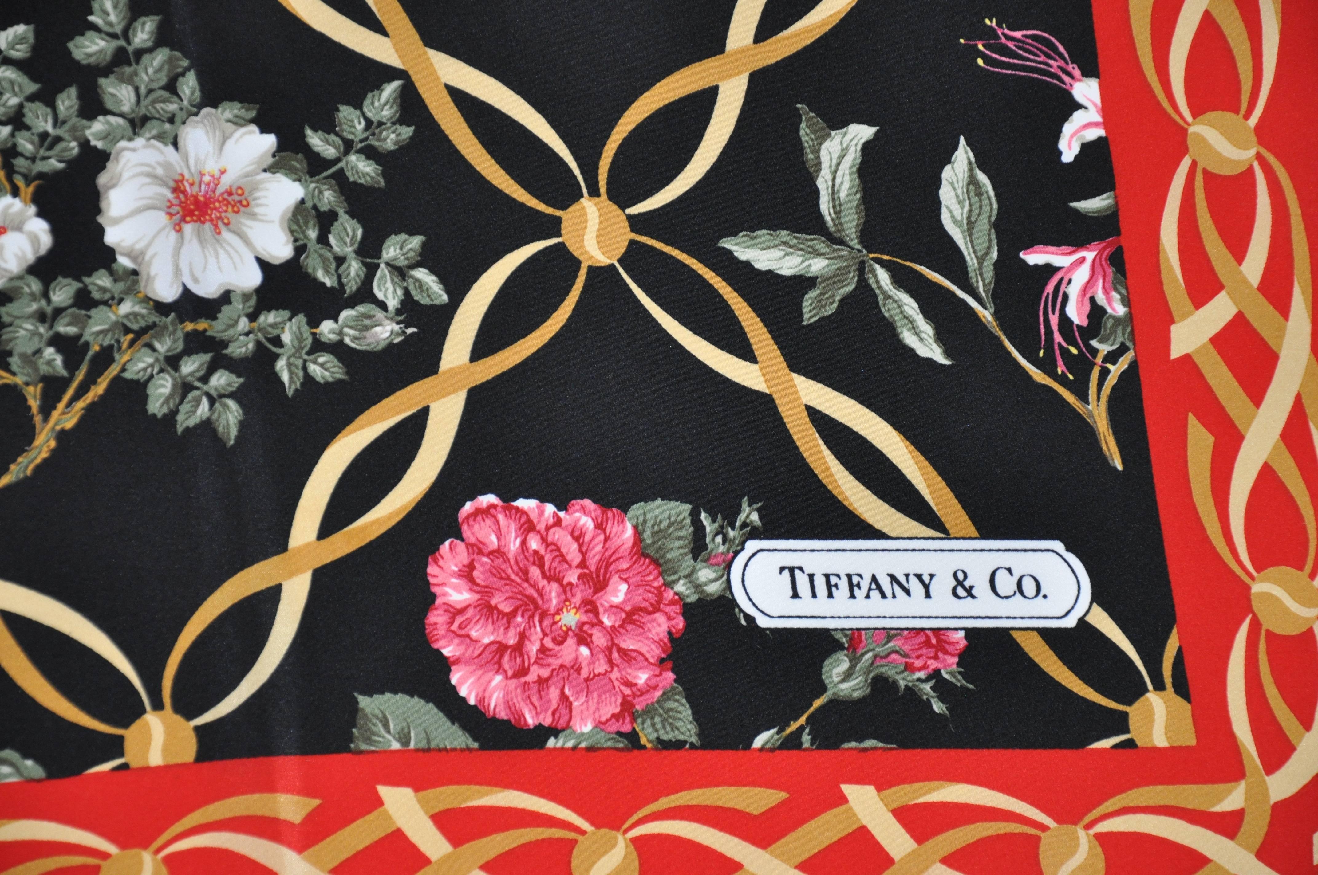    Tiffany & Co wonderfully multi-color festive floral silk scarf, designed by Sybill Connolly, measures 35 inches by 35 inches accented with hand-rolled edges. Made in Itay.