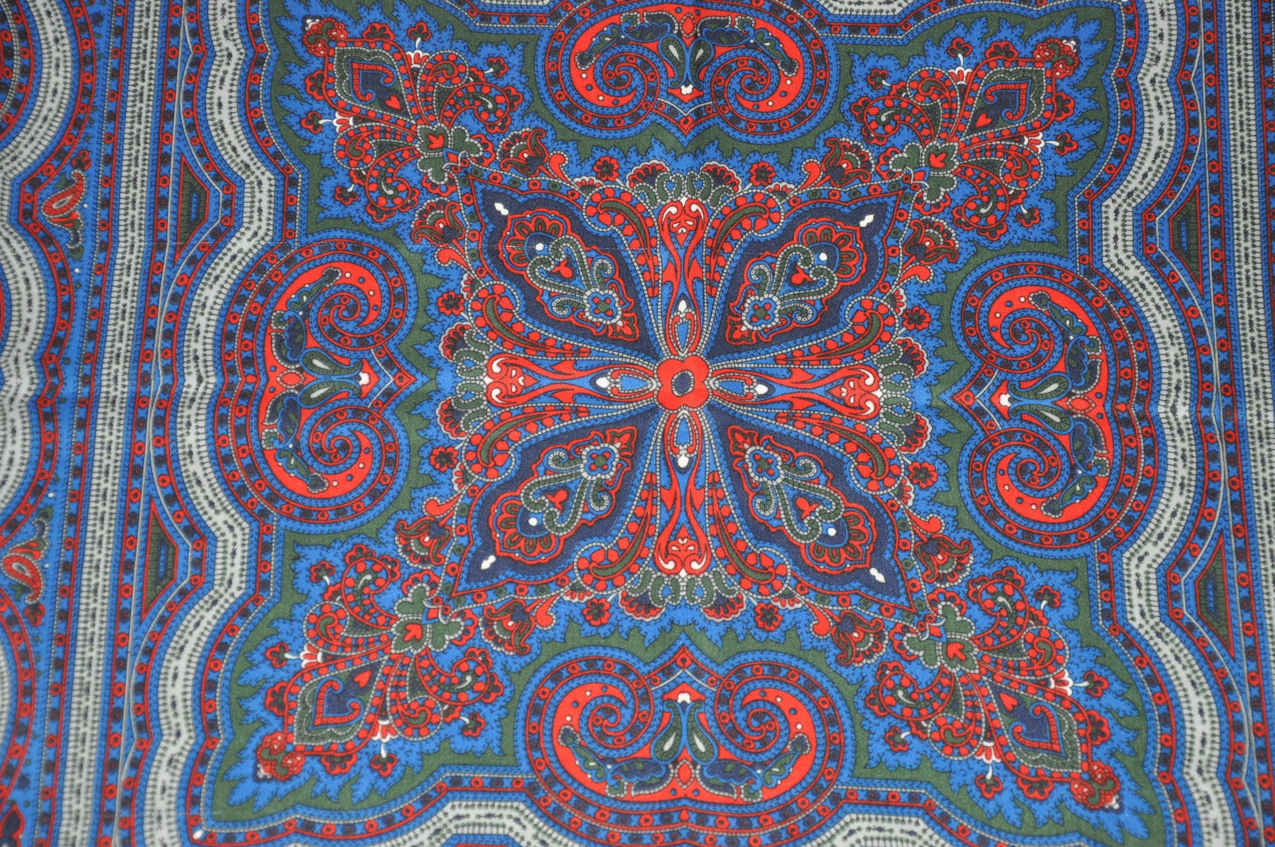        Laura Borghese wonderfully rich large red fringed borders surrounding a multi-color of palseys scarf measures 45 inches by 46 inches. Made of polyester in Italy.
